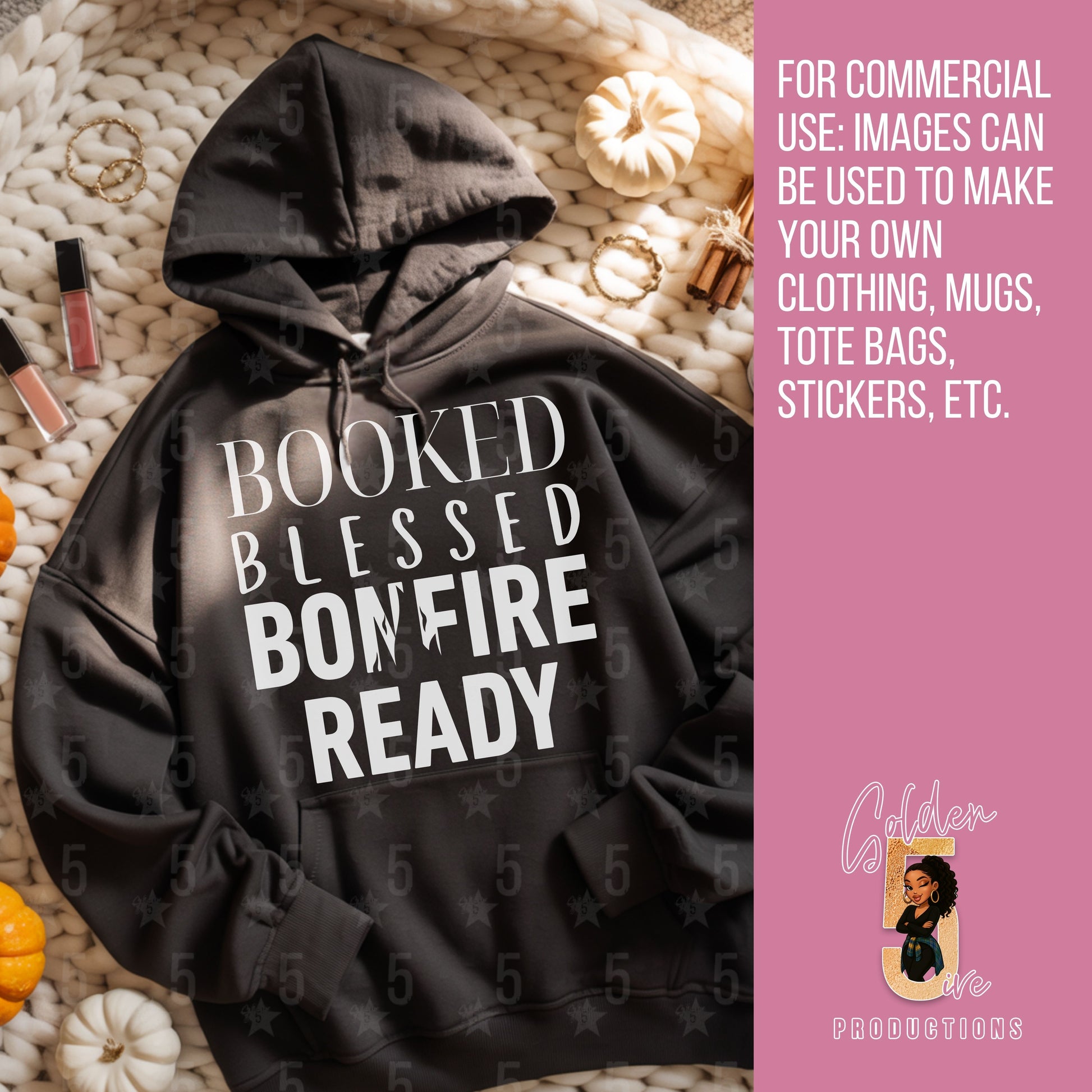 Black hoodie with 'BOOKED BLESSED BONFIRE READY' text on a textured surface with pumpkins and lip gloss.