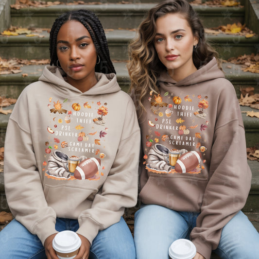 Two people wearing matching hoodies with football-themed designs on a staircase.