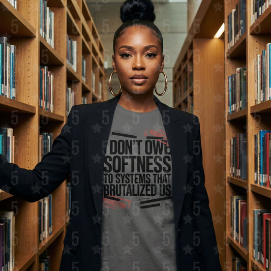 Woman standing in a library wearing a shirt with a message.