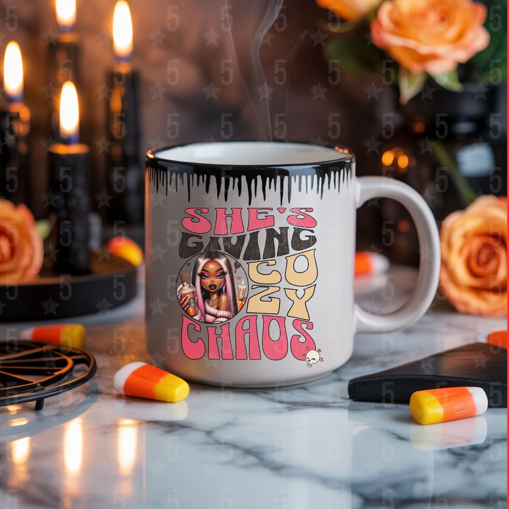 Mug with graphic design and text on a table with decorative items