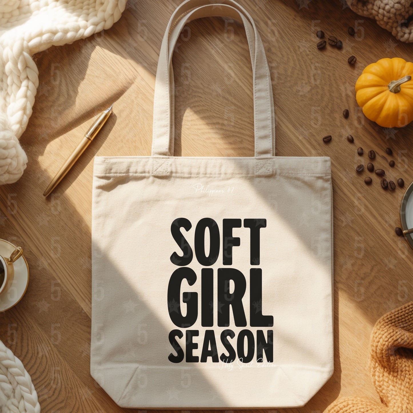 Tote bag with 'SOFT GIRL SEASON' text on a wooden surface with autumn decorations.