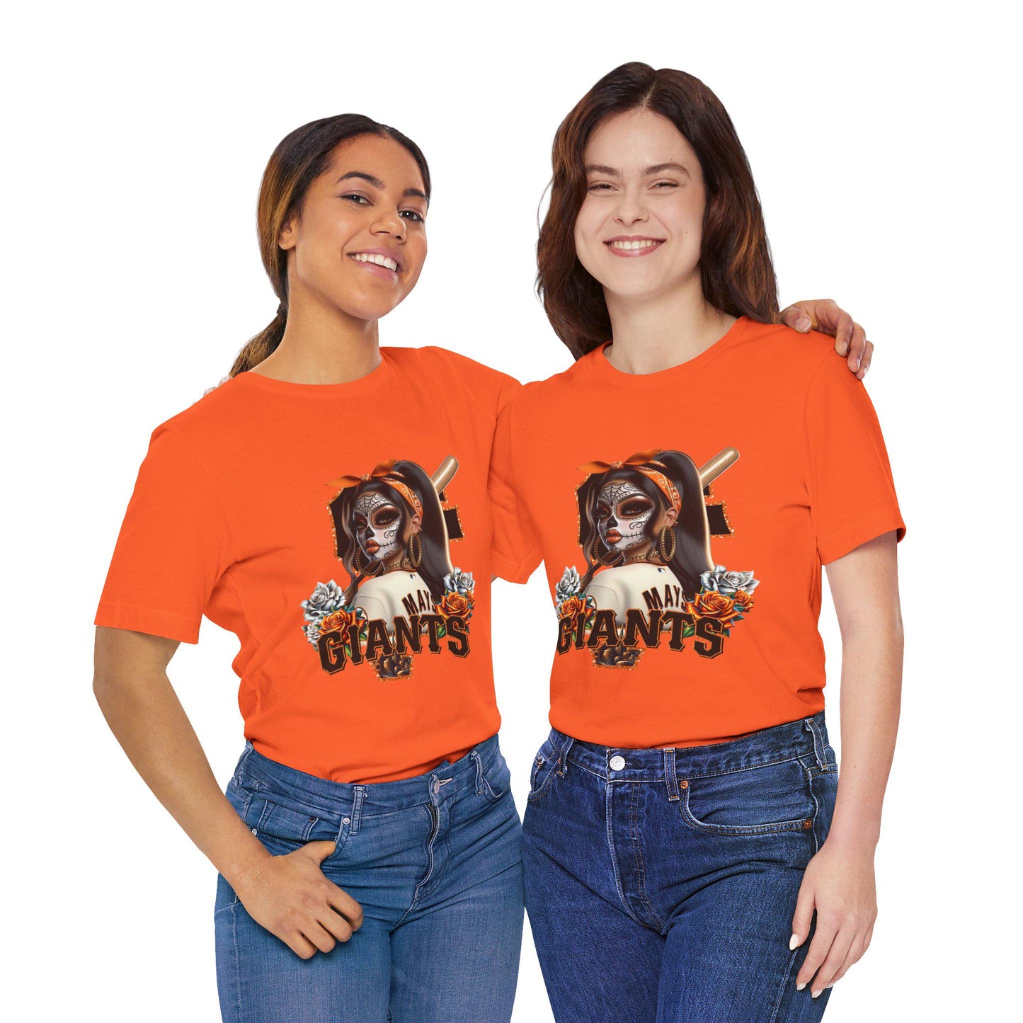 Two people wearing orange t-shirts with a sf giants dia de los muertos design on a white background