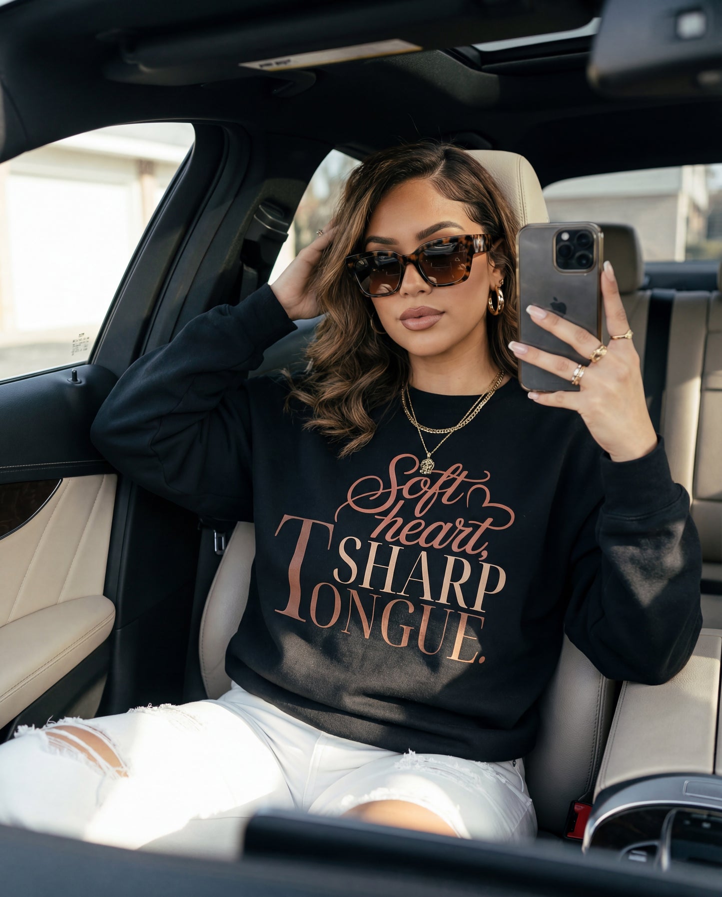 latina woman in a black crewneck with a sassy saying