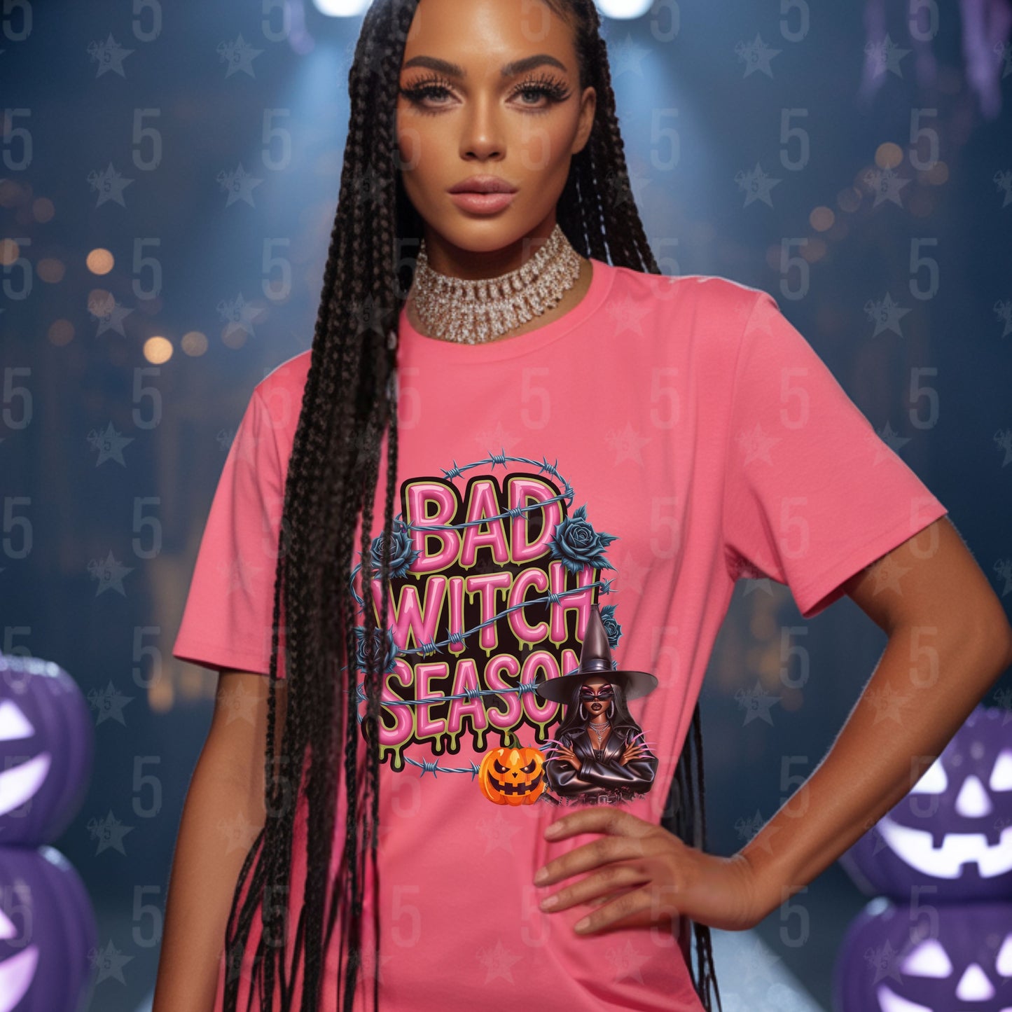 Woman wearing a pink 'Bad Witch Season' t-shirt with Halloween-themed graphics against a festive background.