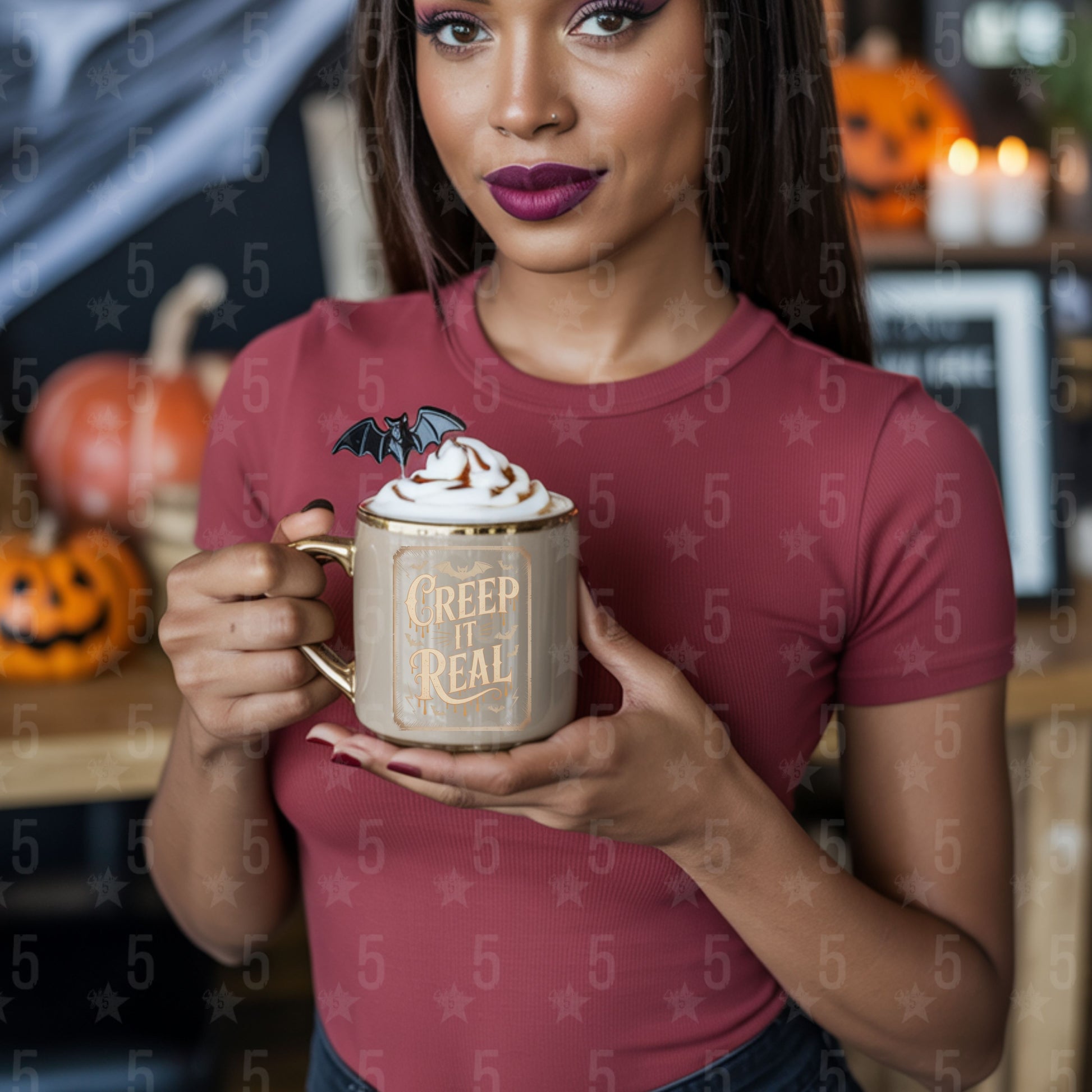 Woman holding a Halloween-themed mug with a decorative background