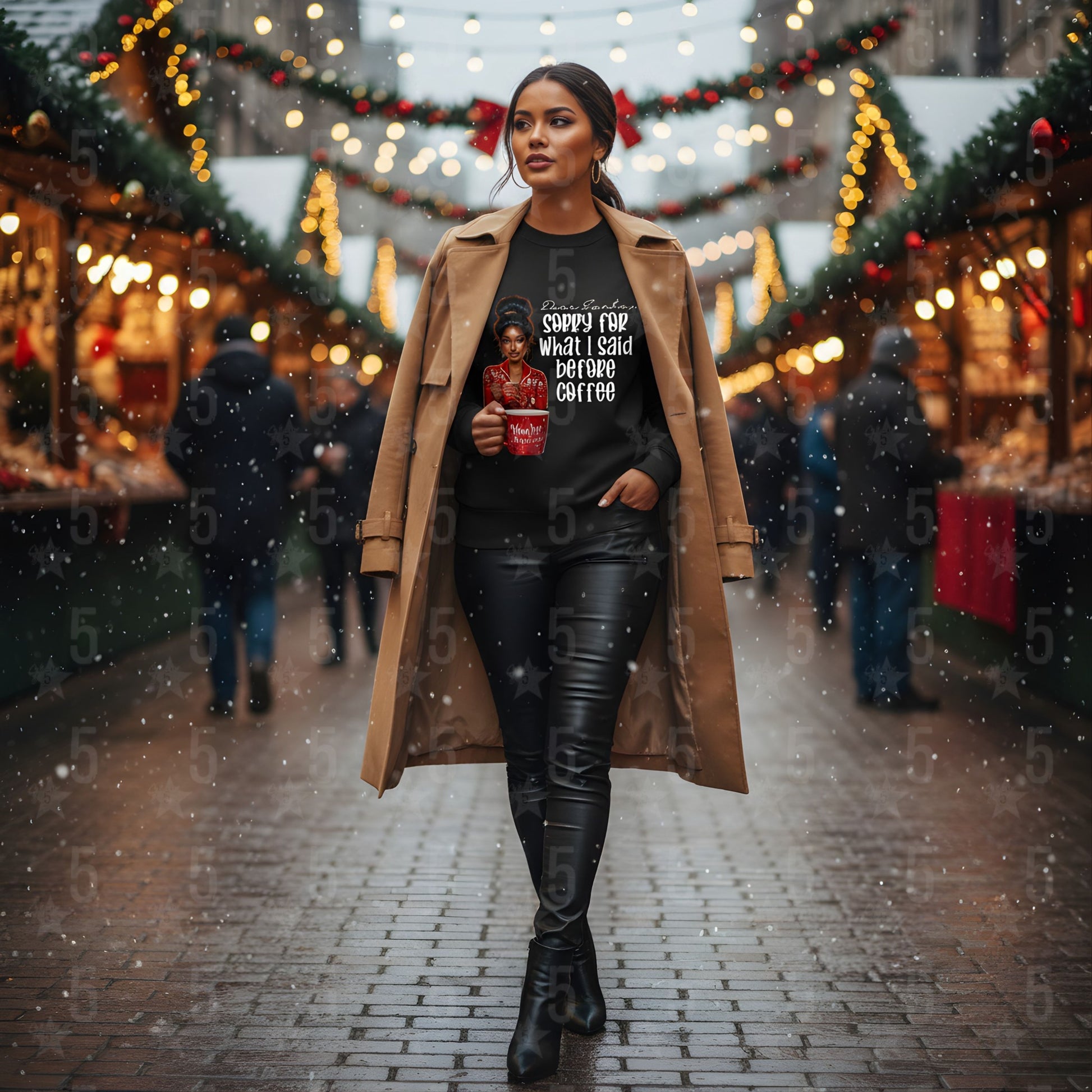Woman walking through a festive market holding a coffee cup, wearing a long coat and black pants.