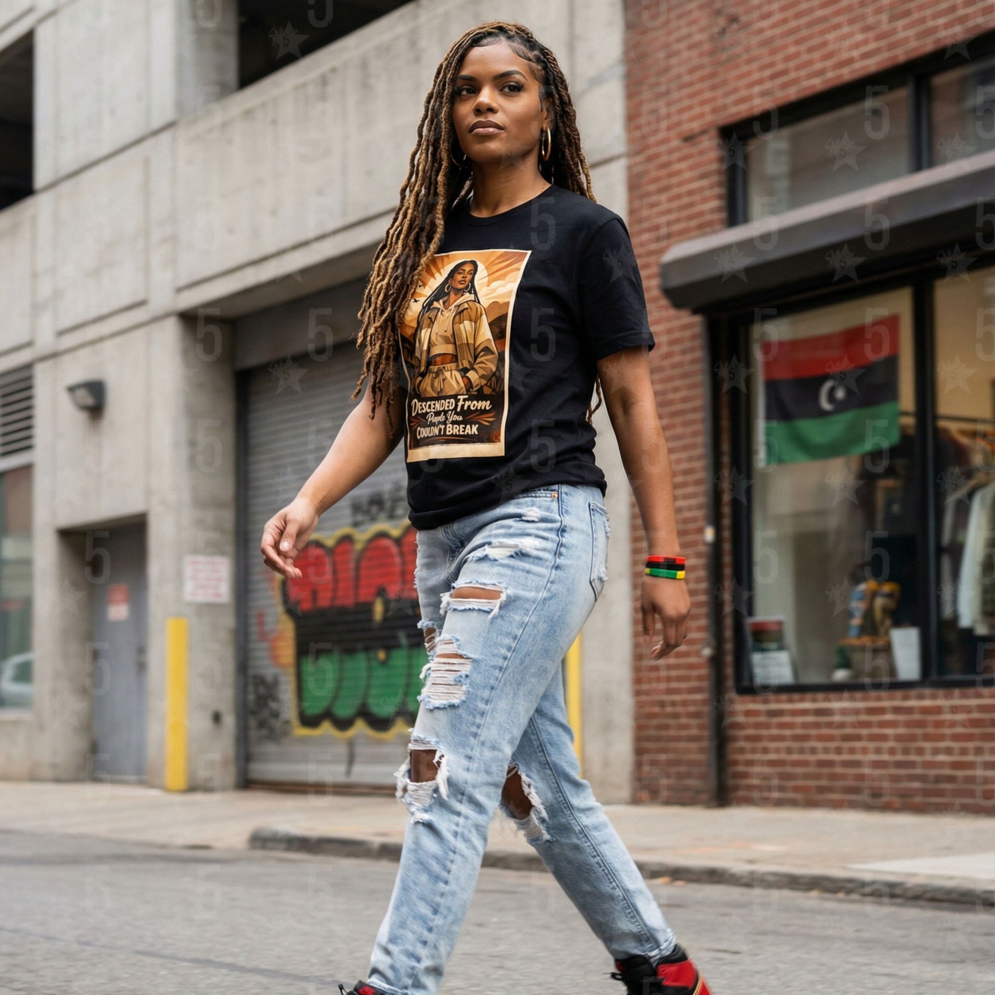black woman wearing a black tee with a black history month design on it