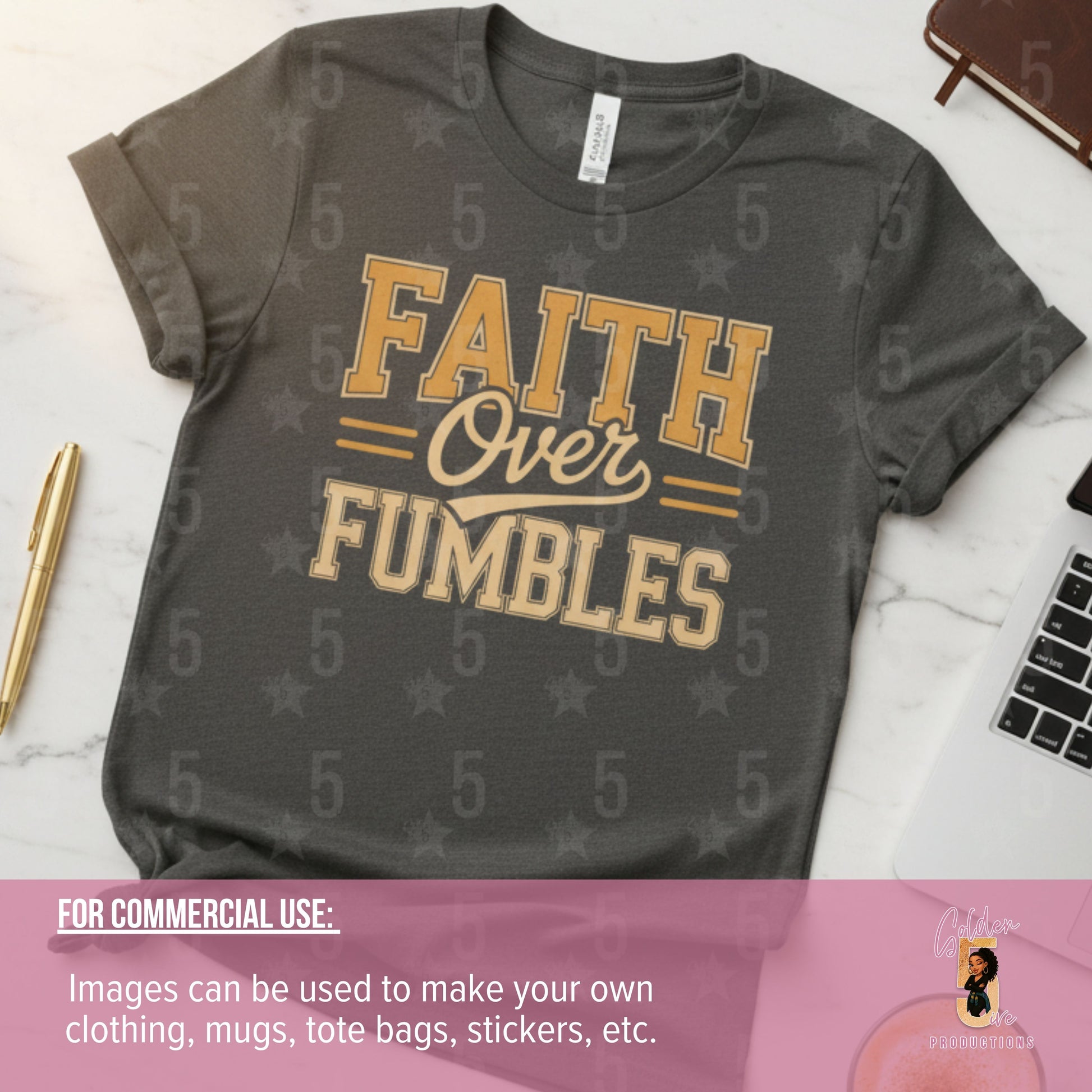 Gray t-shirt with 'Faith Over Fumbles' text on a white surface with a laptop and pen.