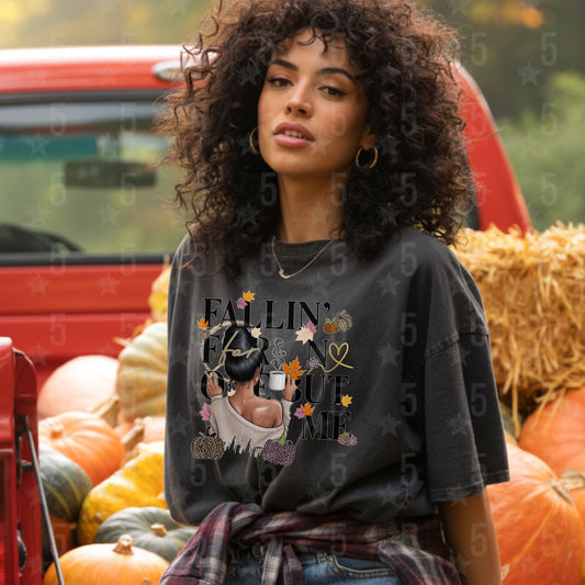 Woman wearing a graphic t-shirt with pumpkins and text in an outdoor setting
