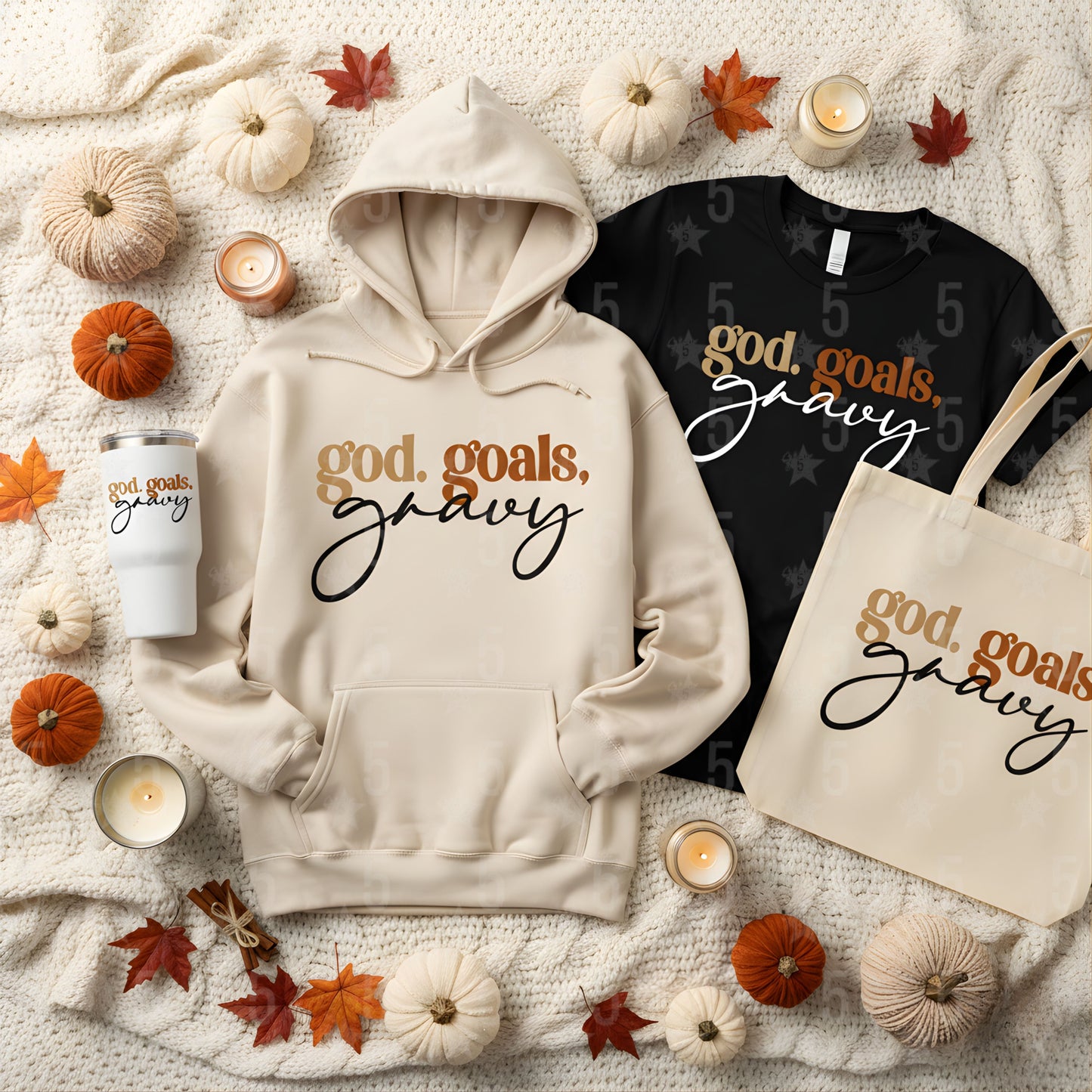 Hoodie, t-shirt, tote bag, and mug with 'god, goals, gravy' text on a fall-themed background.