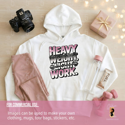 White hoodie with 'Heavy Weight Light Work' text, camera, gift box, and water bottle on a wooden surface.
