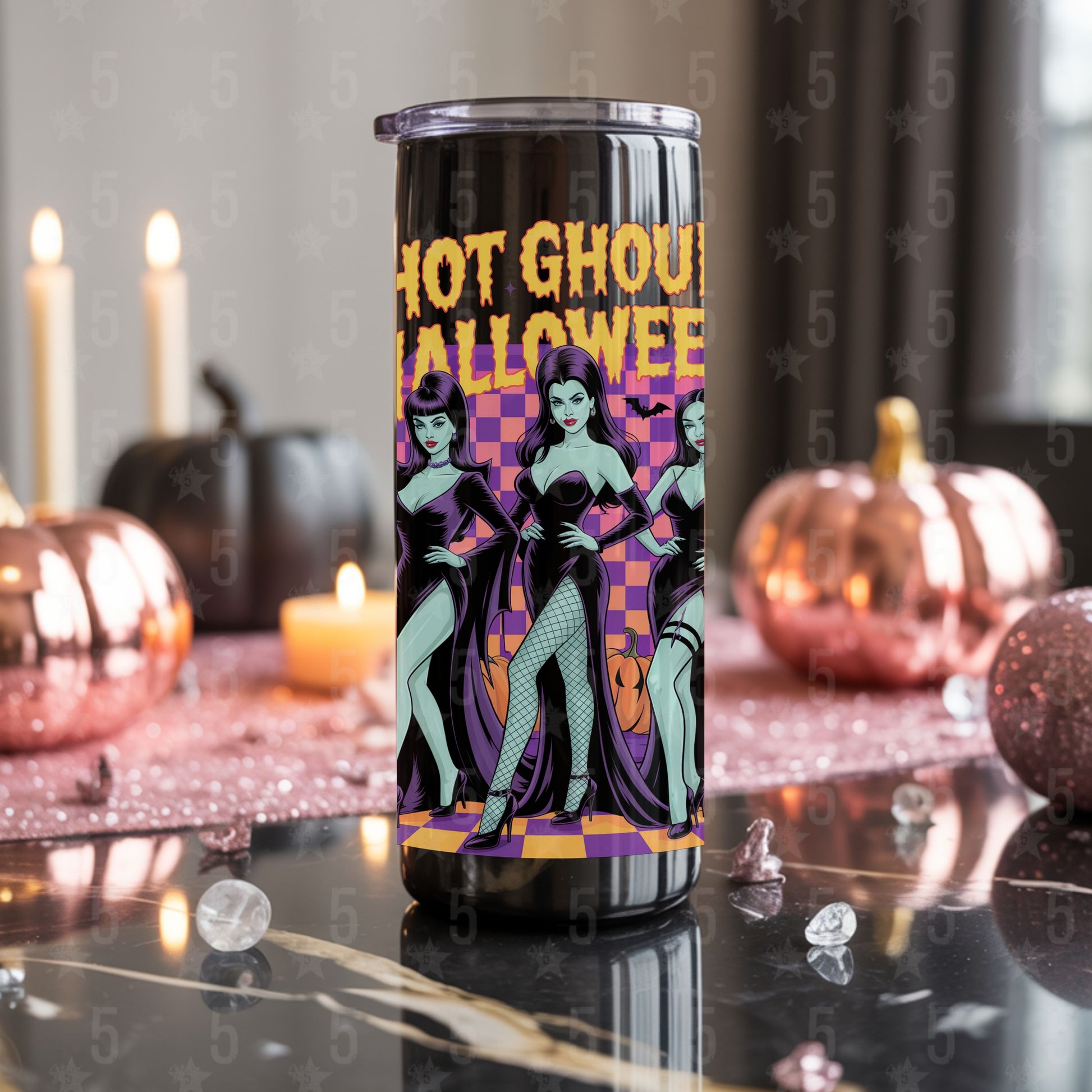 Halloween-themed tumbler with graphic design on a decorative table with pumpkins and candles.