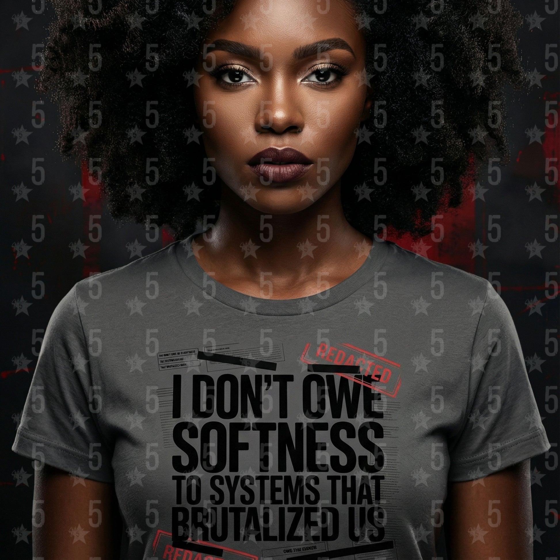 Person wearing a gray t-shirt with a message on a dark background