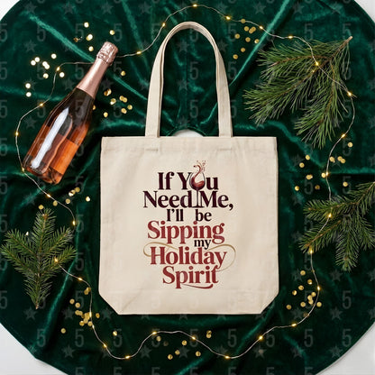 Beige tote bag with humorous text on a green fabric background with bottle and decorations