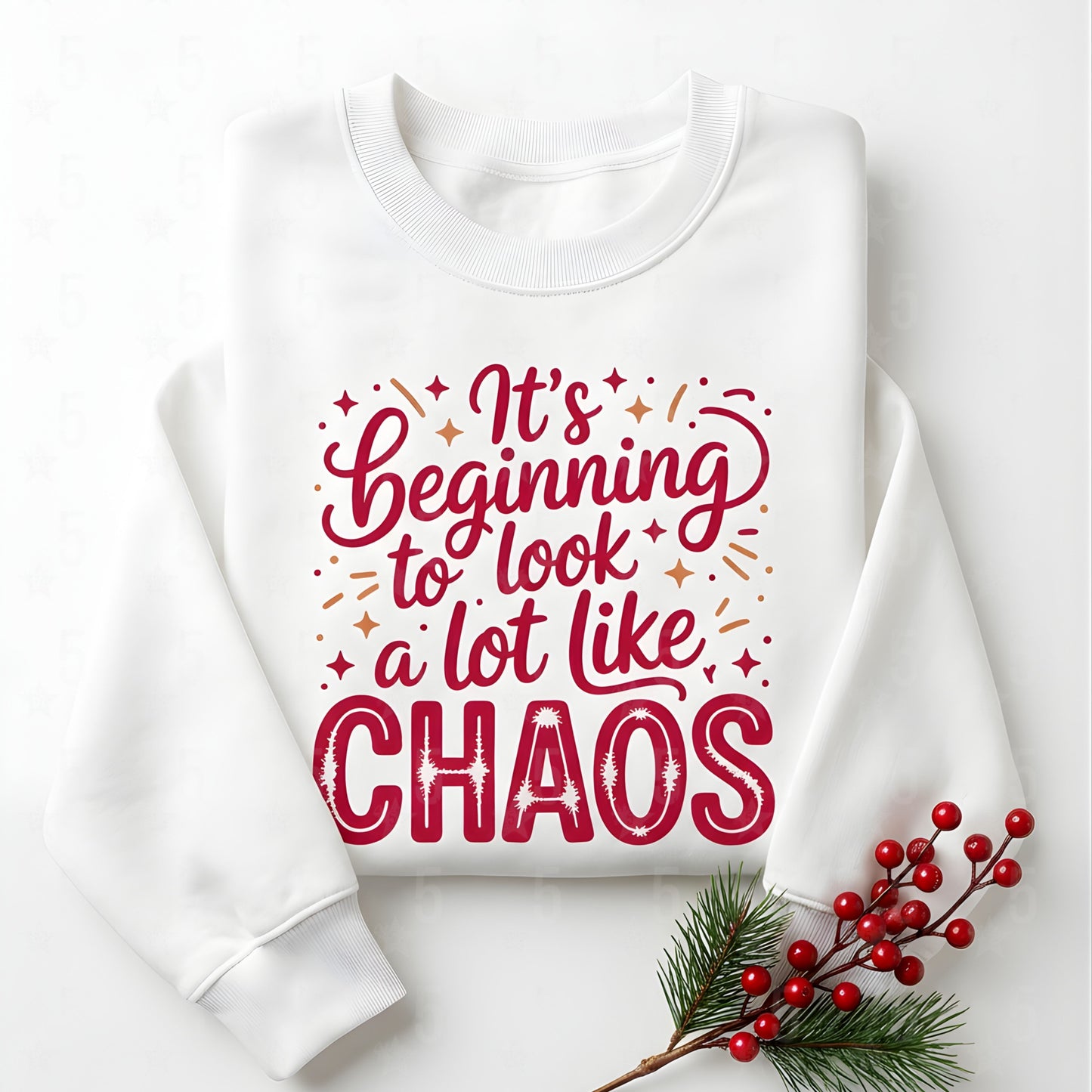 White sweatshirt with red text 'It's beginning to look a lot like CHAOS' on a white background with Christmas decorations.