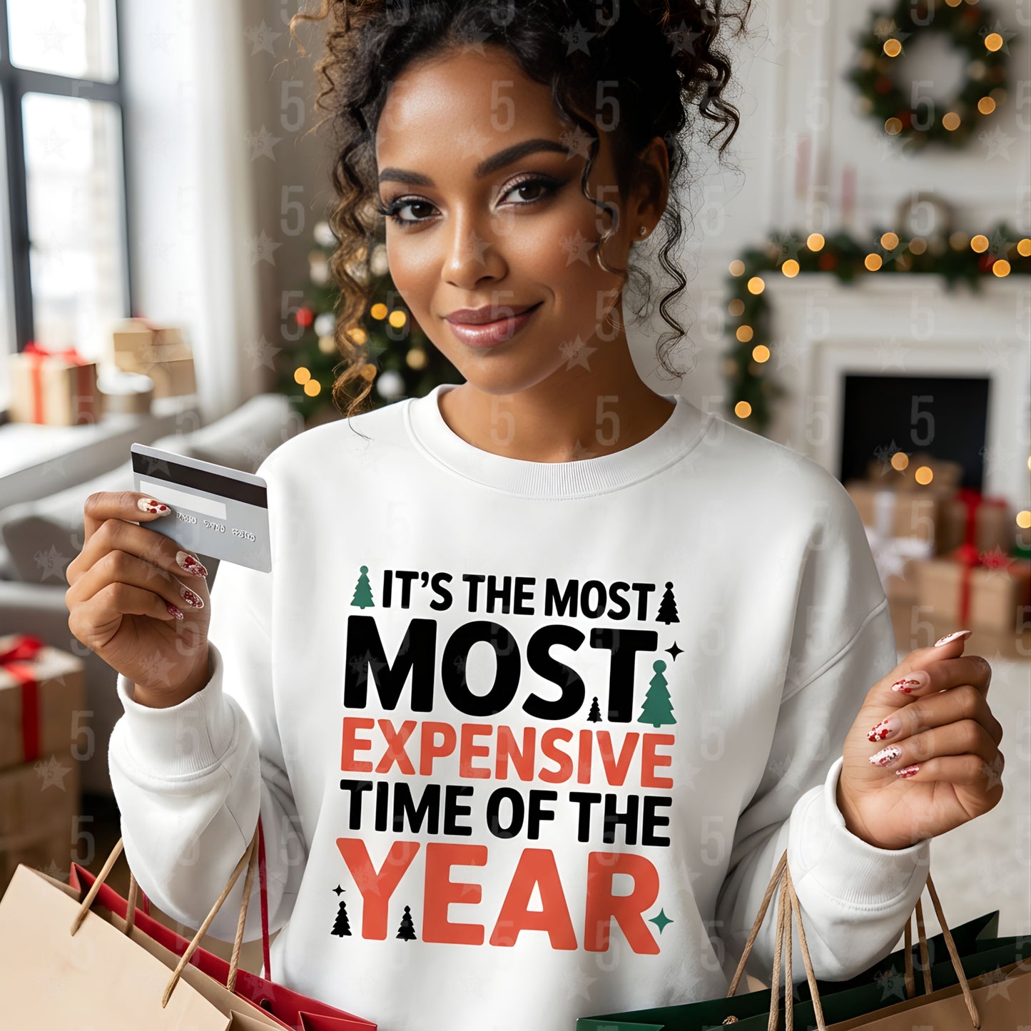 Woman wearing a white sweatshirt with a humorous Christmas message, holding a credit card and shopping bags in a festive setting.