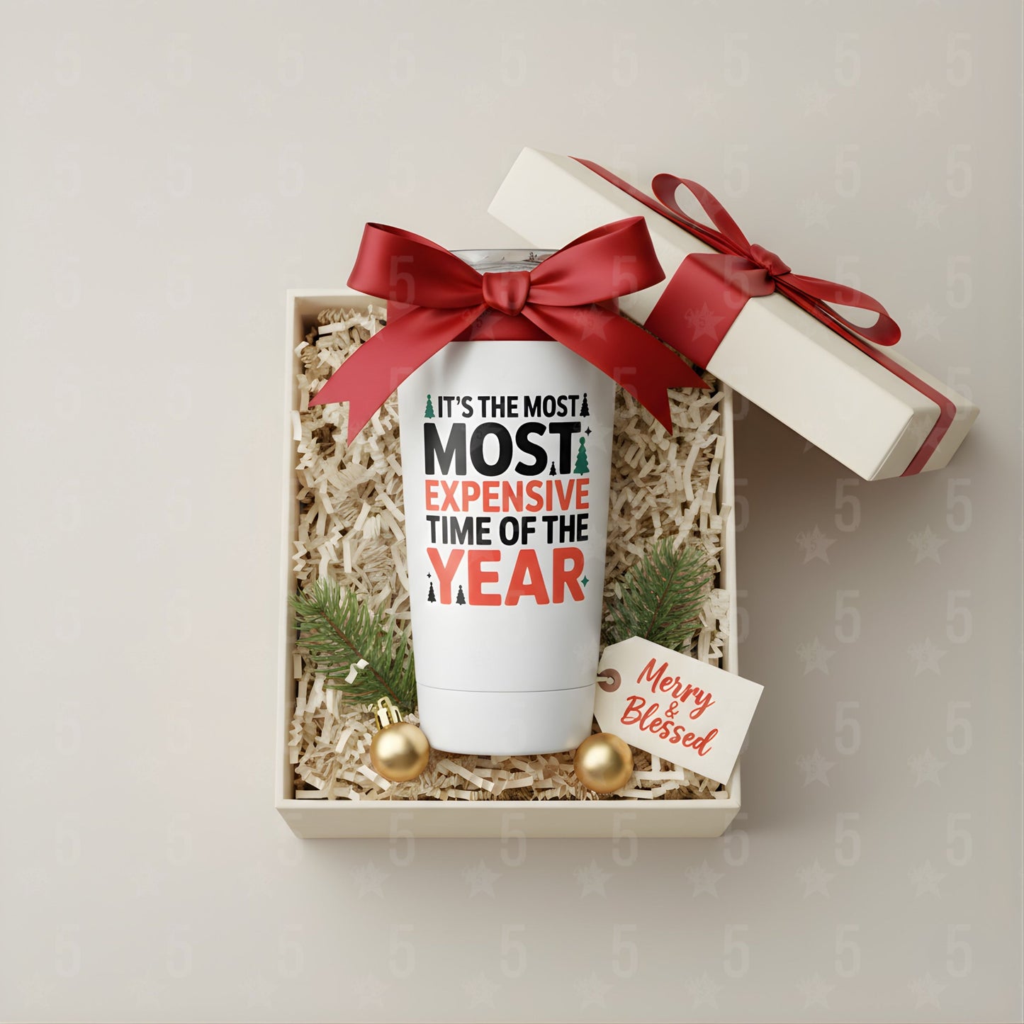 White tumbler with humorous text in a gift box with a red ribbon on a light background