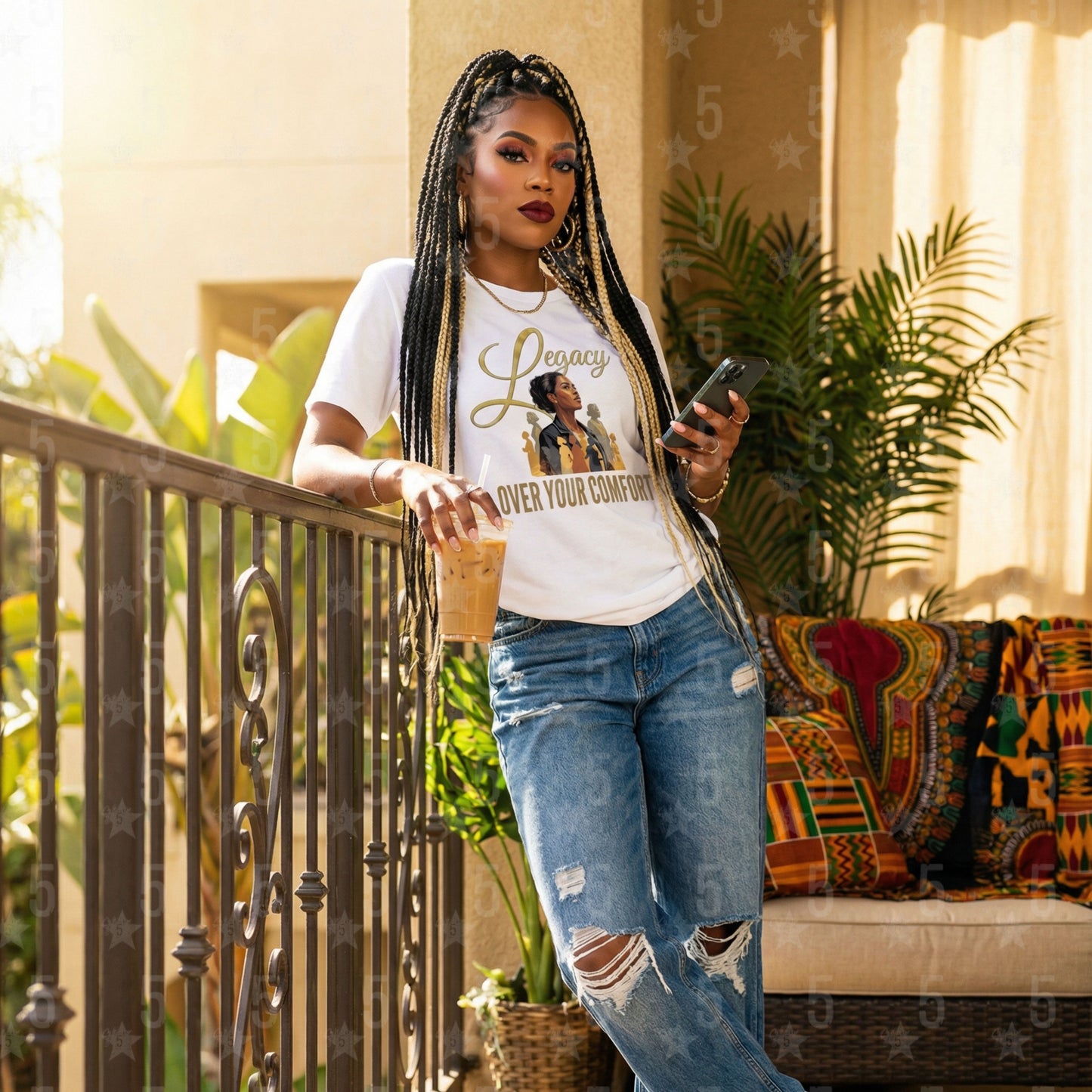 black woman wearing a white "Legacy Over Your Comfort" shirt