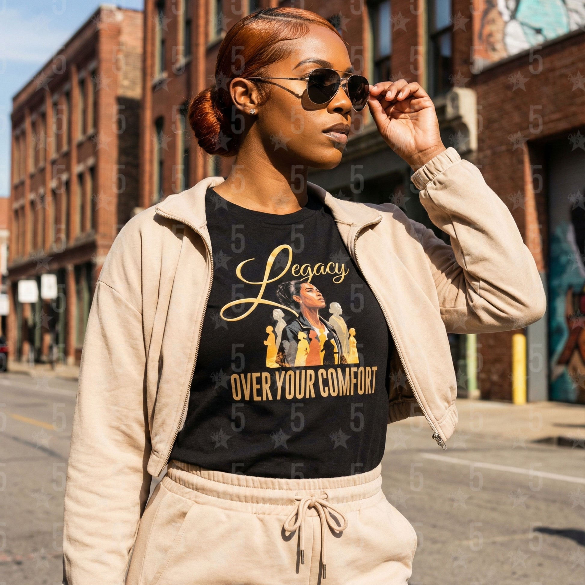 Black woman wearing a "Legacy Over Your Comfort" shirt with beige athleisure bottoms