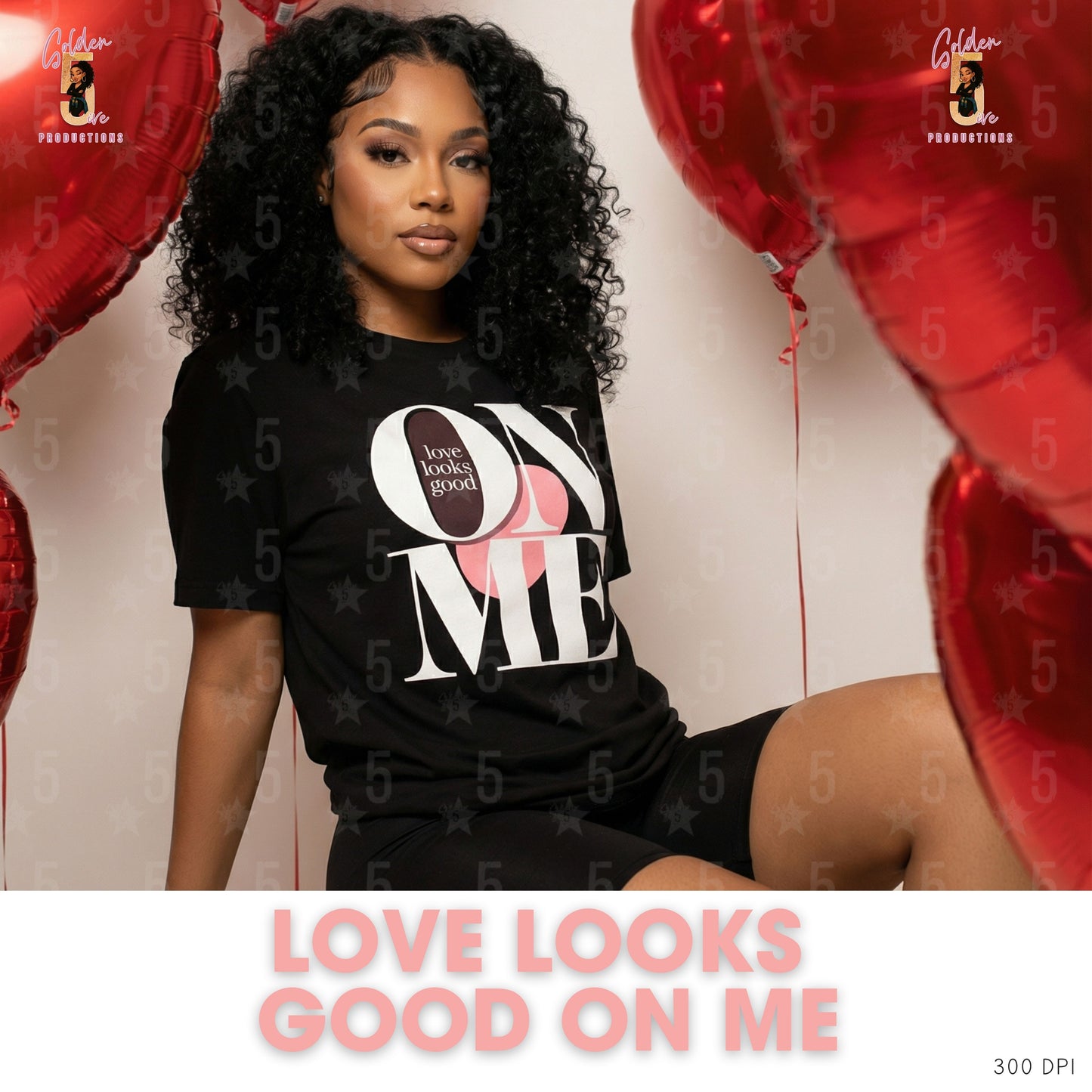 Woman wearing a black t-shirt with 'Love Looks Good On Me' text, surrounded by red balloons.