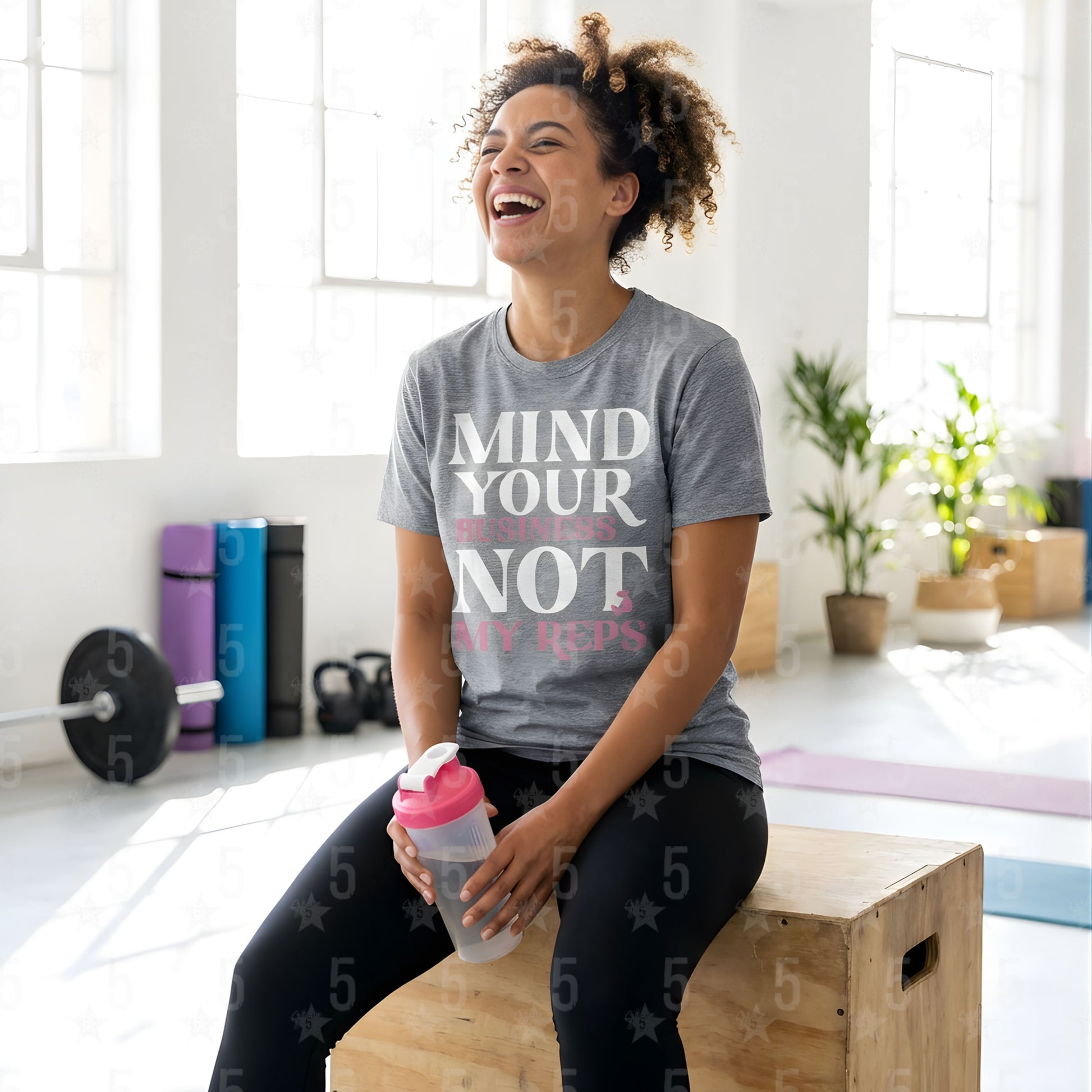 A woman laughing at a yoga studio