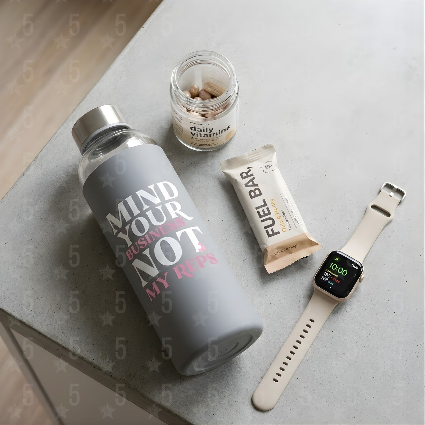 A water bottle, smartwatch and protein bar on a table