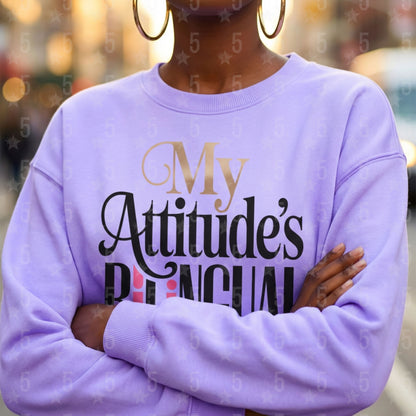 Person wearing a purple sweatshirt with text, blurred background