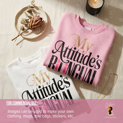 Two sweaters with 'My Attitude's Bilingual' text on a light surface.