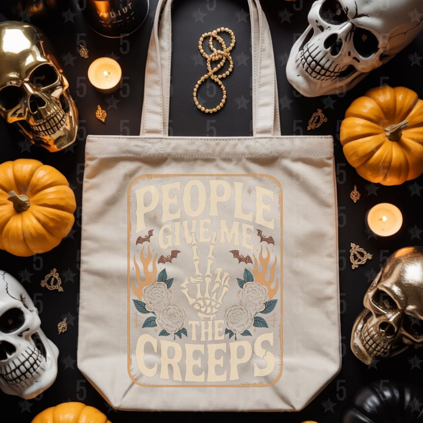 Tote bag with Halloween-themed design featuring skulls and pumpkins on a dark background.