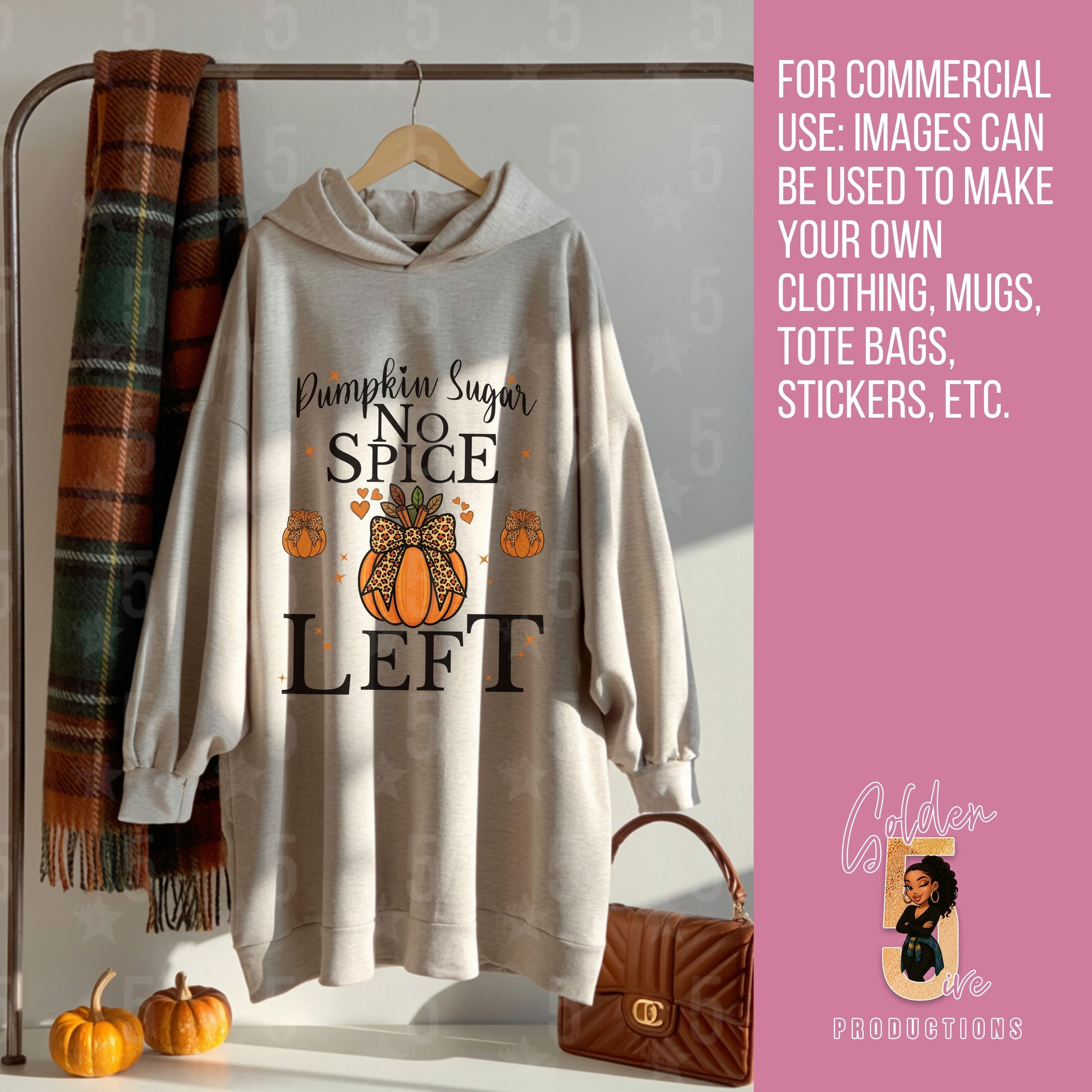 Beige hoodie with pumpkin spice design on a rack with pumpkins and a plaid scarf.