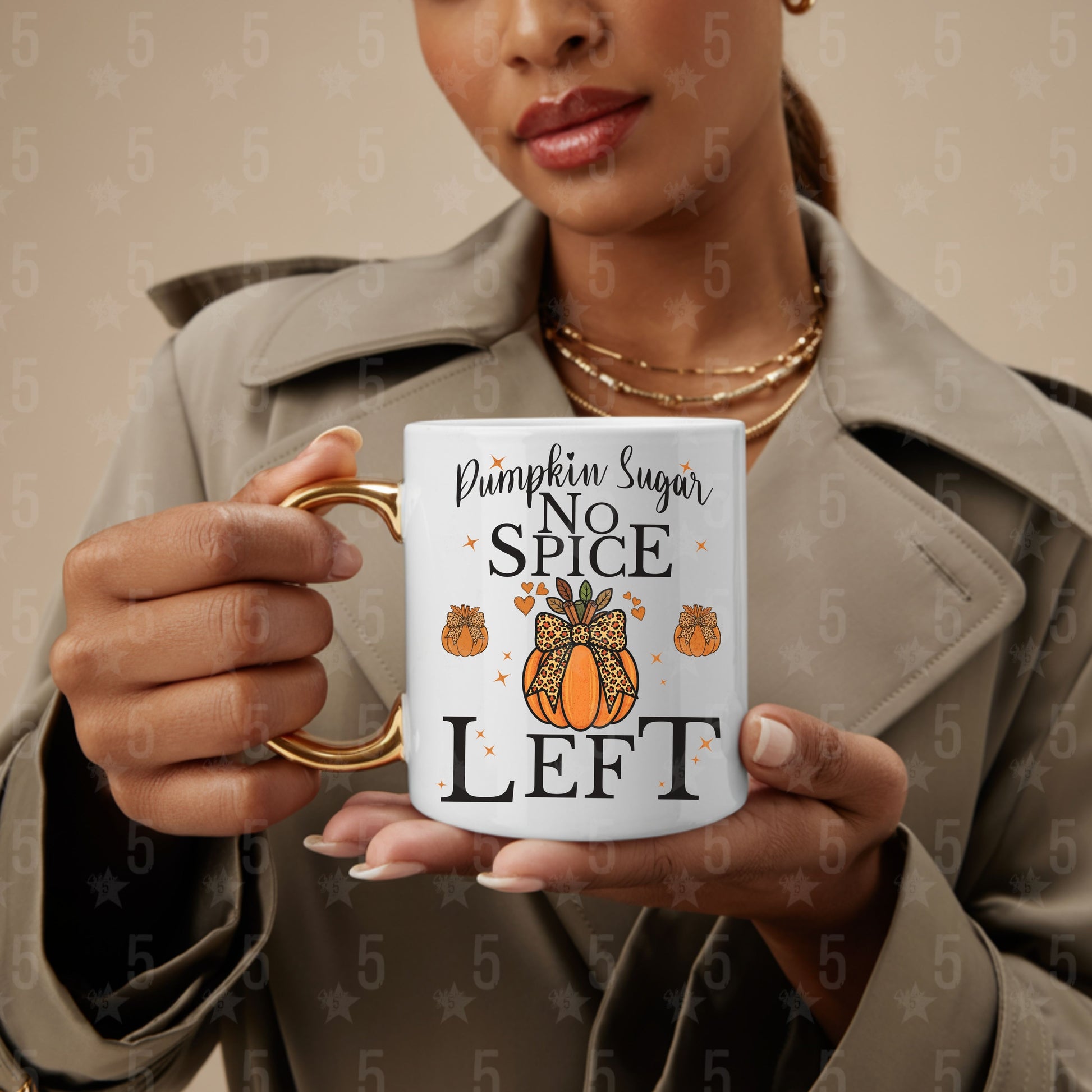 Person holding a mug with 'Pumpkin Sugar No Spice Left' text and pumpkin design.