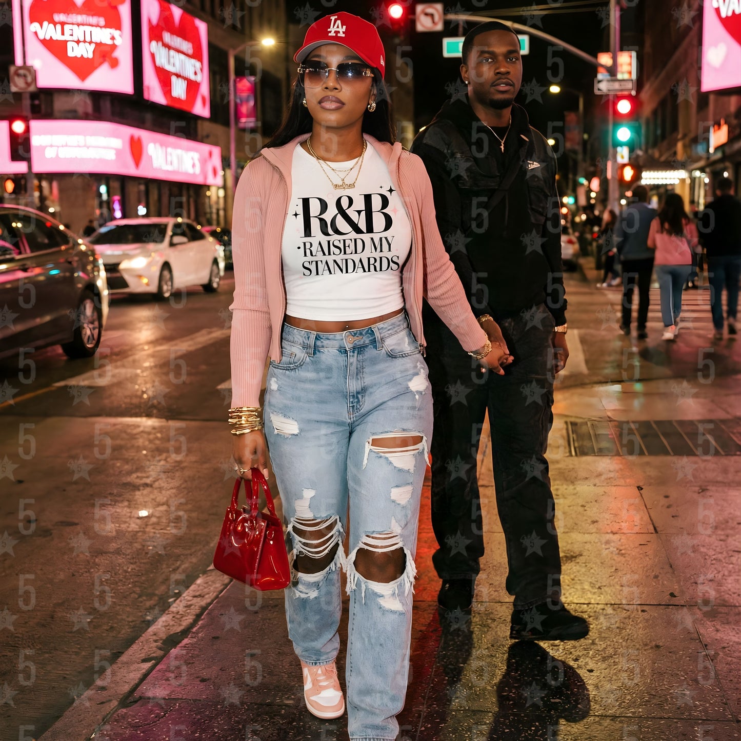 A couple walking on a city street at night with Valentine's Day decorations.