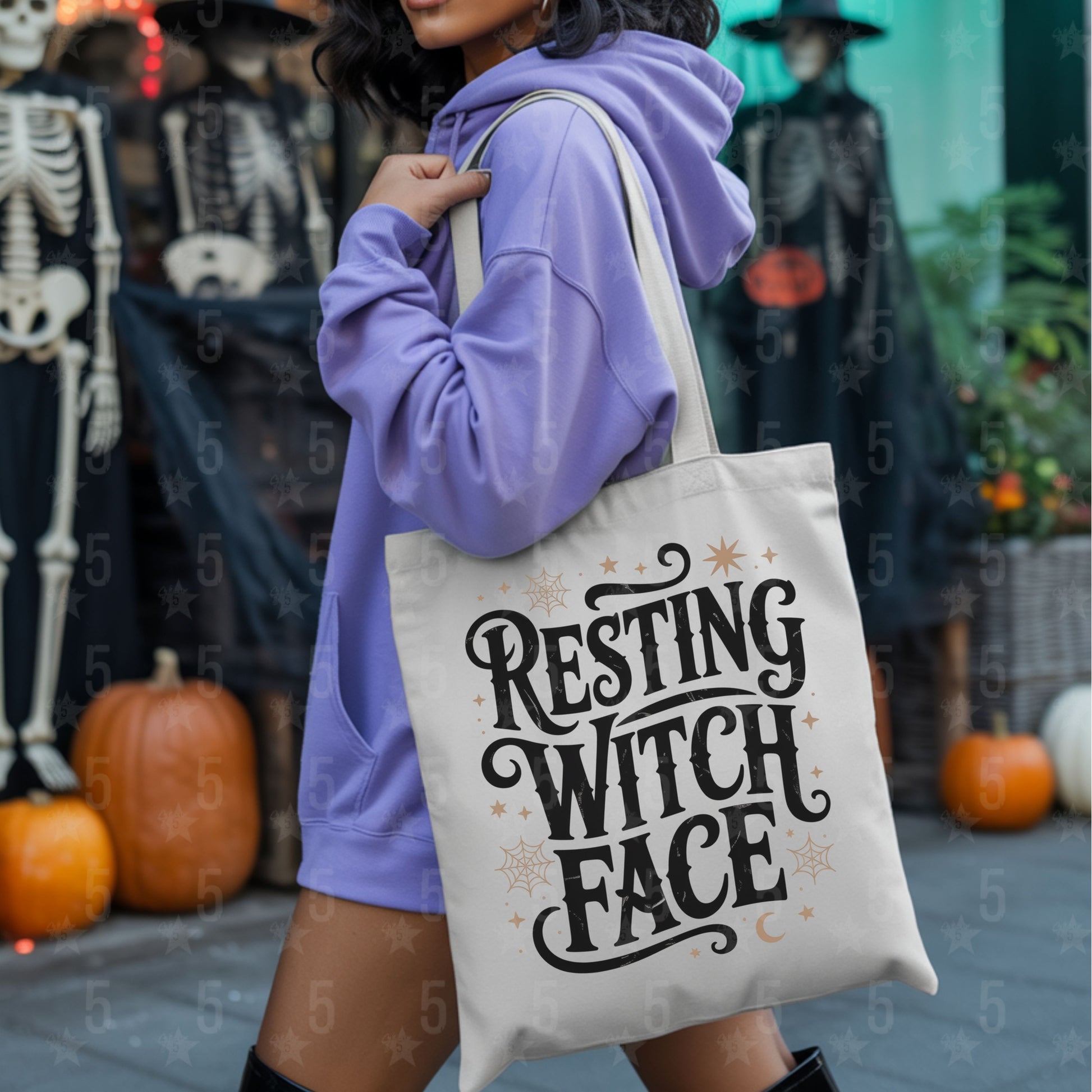 Person holding a tote bag with 'Resting Witch Face' text in a Halloween-themed setting.