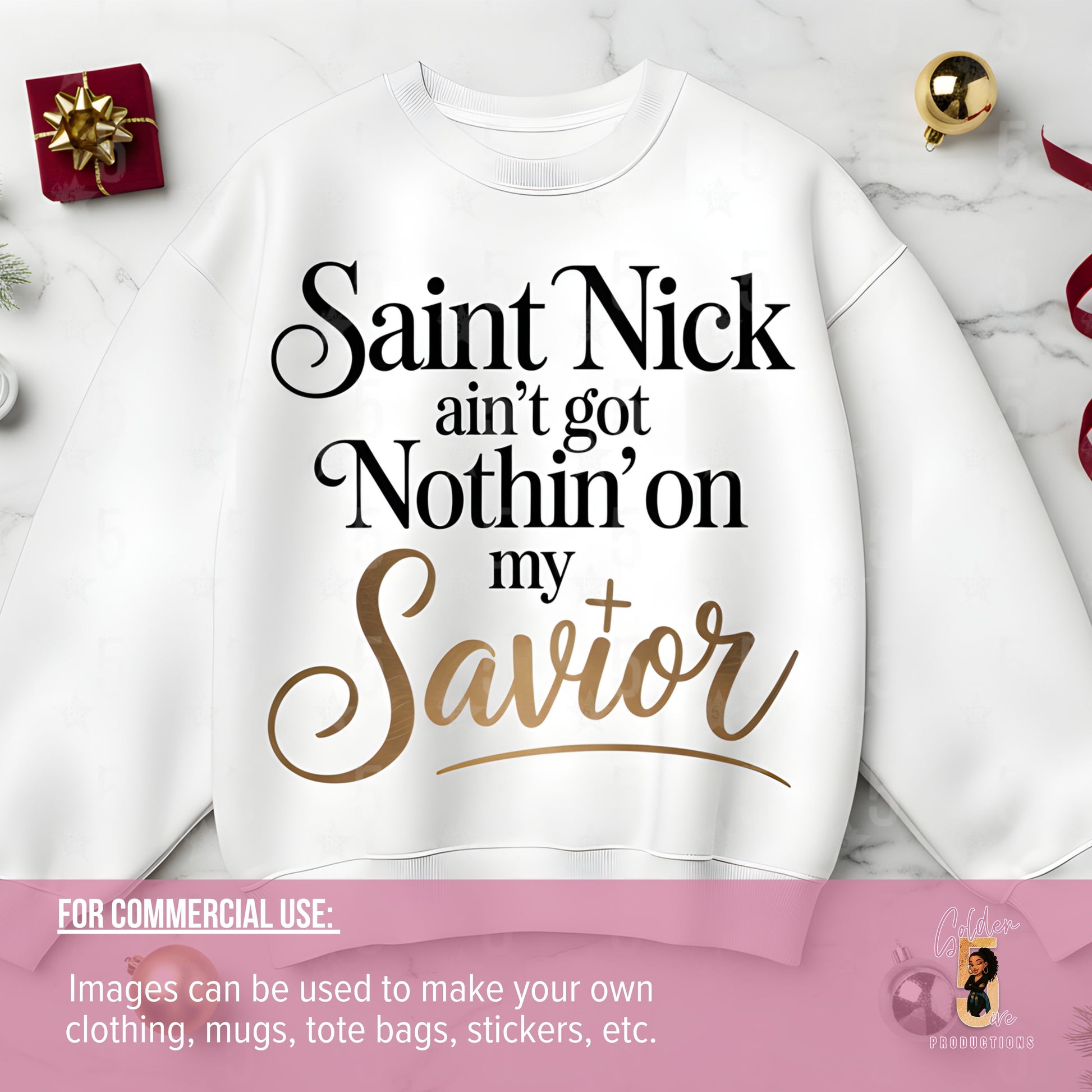 White sweatshirt with text 'Saint Nick ain't got Nothin' on my Savior' on a marble surface.