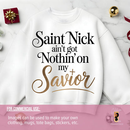 White sweatshirt with text 'Saint Nick ain't got Nothin' on my Savior' on a marble surface.