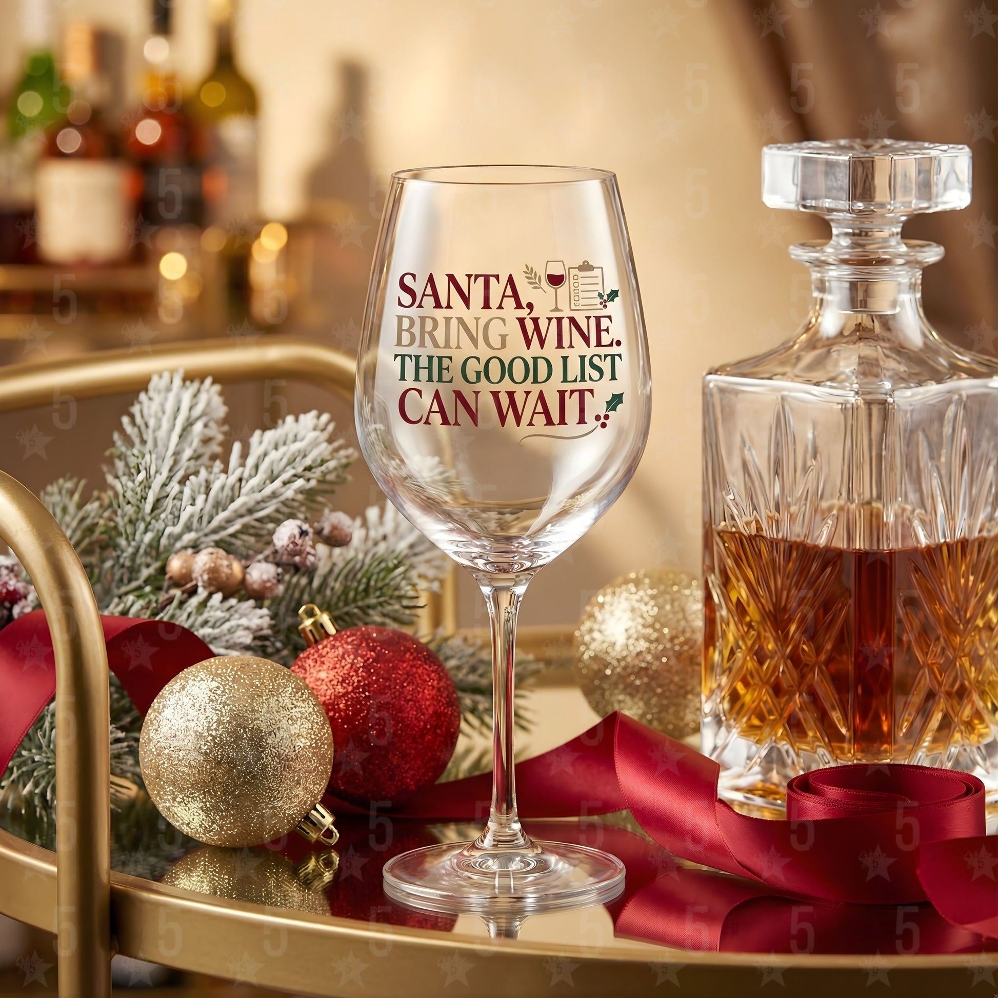 Wine glass with humorous text on a festive table setting with a decanter and Christmas decorations.