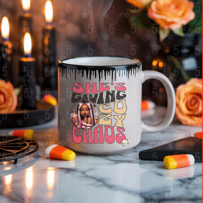Mug with graphic design and text on a table with decorative items