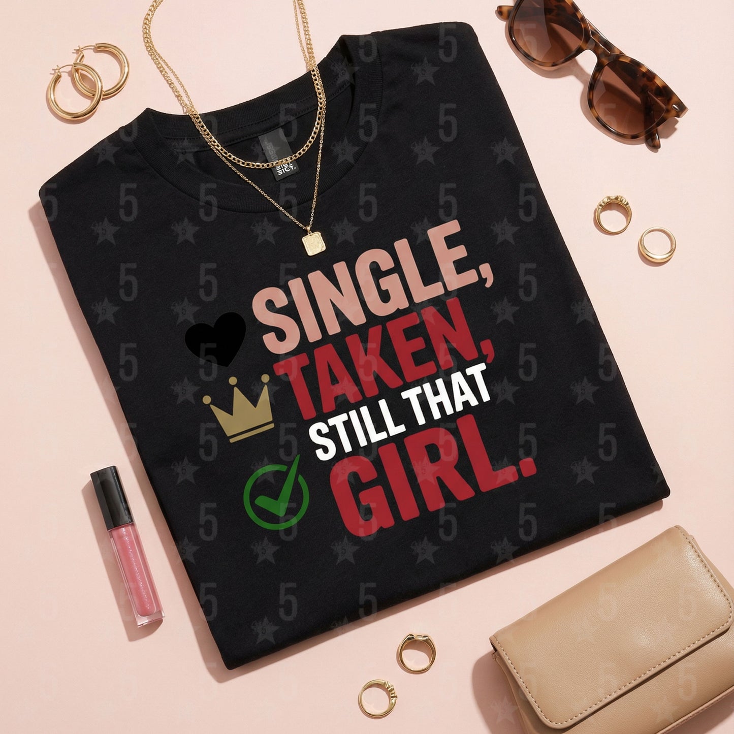 Black t-shirt with 'Single, Taken, Still That Girl' text on a pink background with accessories.