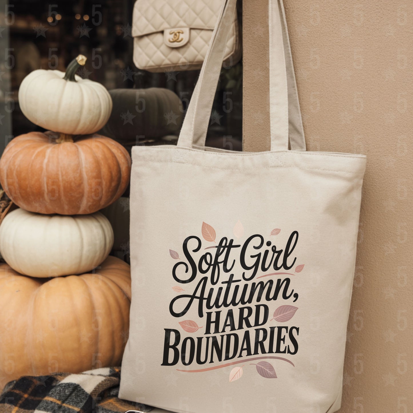 Tote bag with 'Soft Girl Autumn, Hard Boundaries' text next to pumpkins