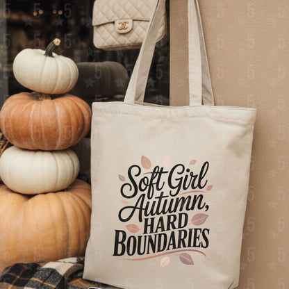 Tote bag with 'Soft Girl Autumn, Hard Boundaries' text next to pumpkins