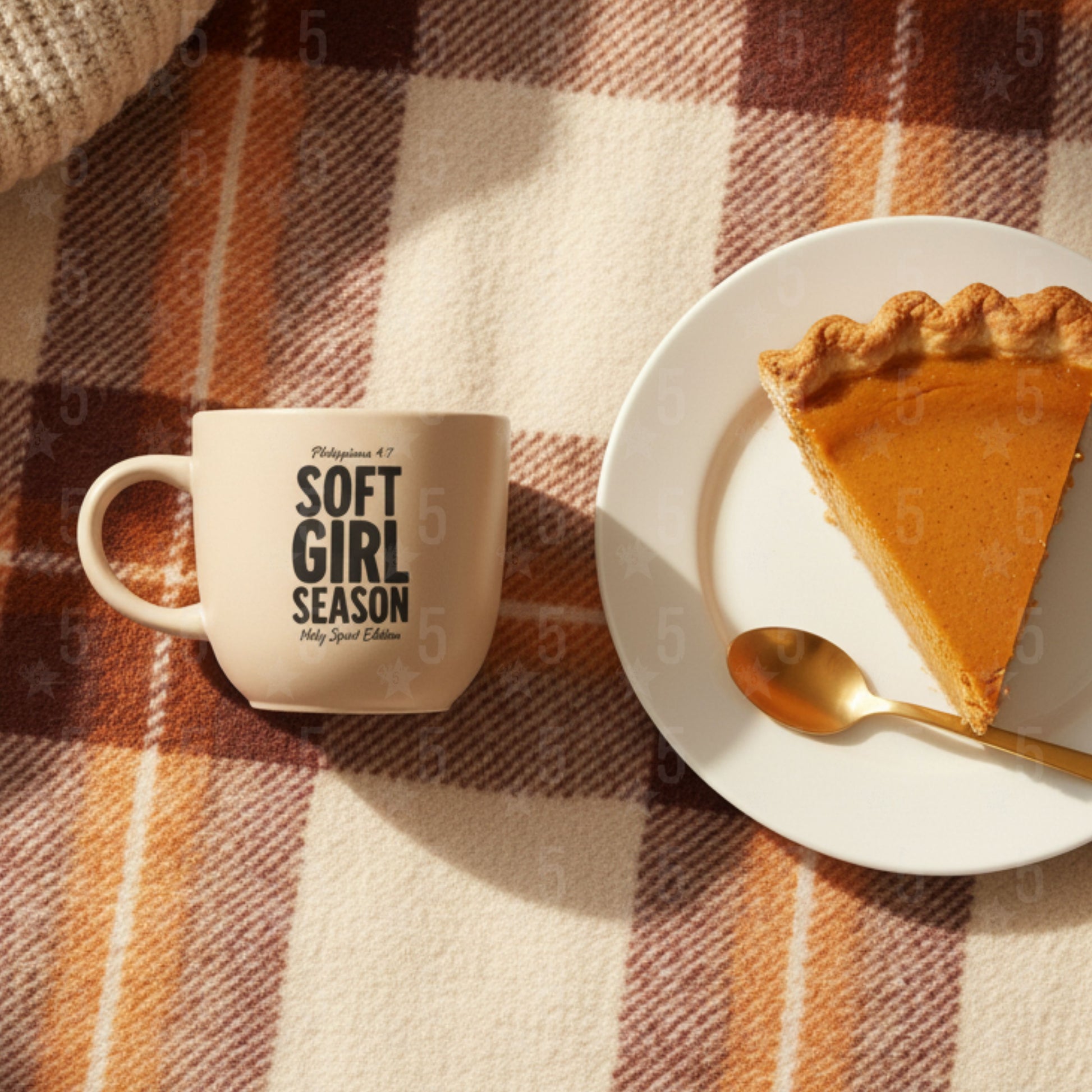 Mug with 'Soft Girl Season' text next to a slice of pie on a plaid tablecloth