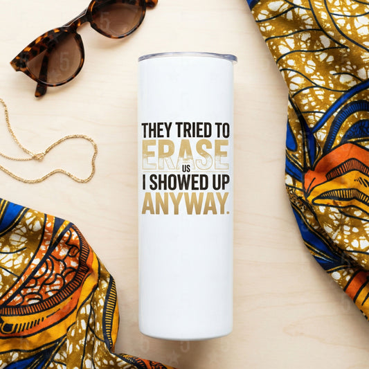 Tumbler with motivational quote surrounded by sunglasses and fabric on a beige surface