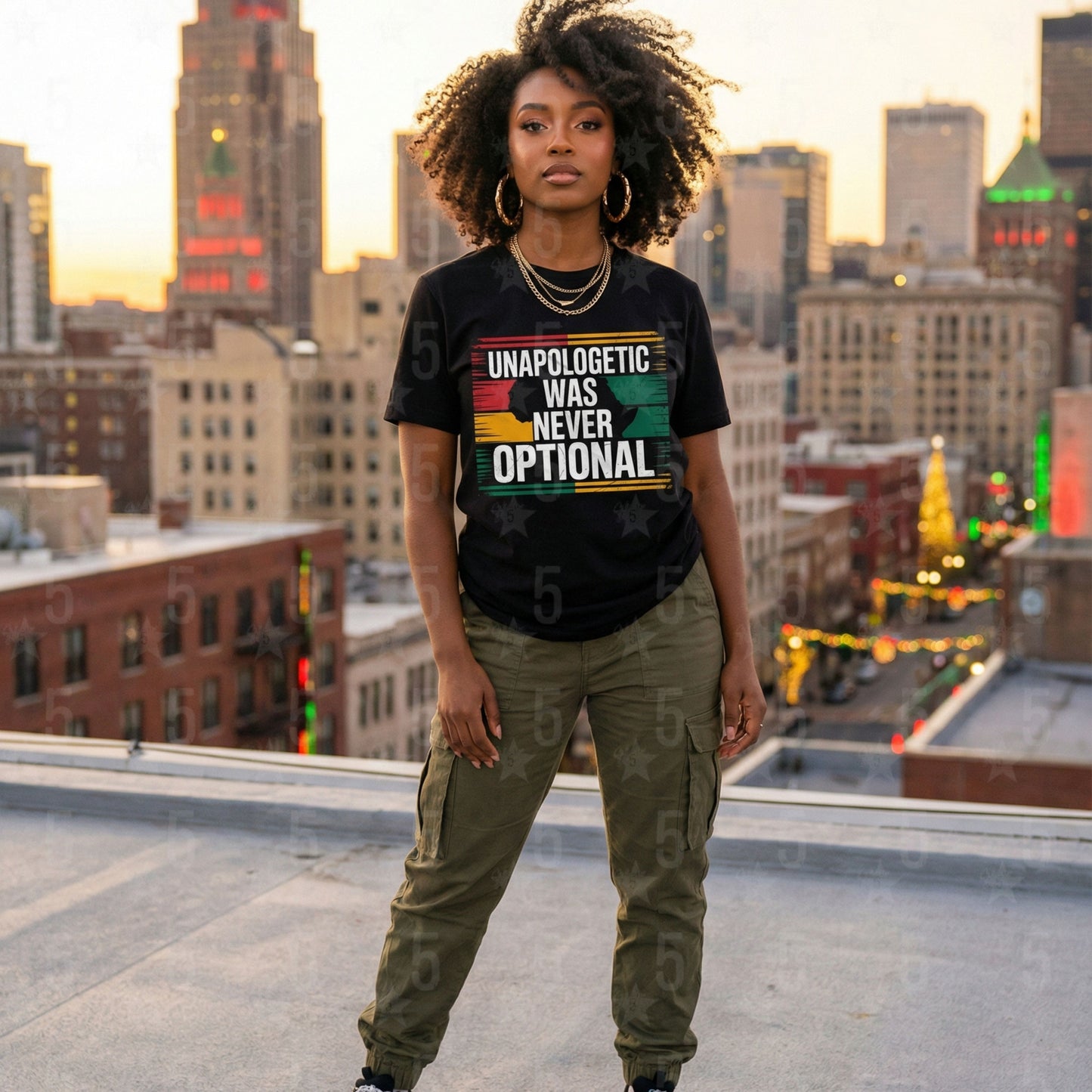 Woman wearing a t-shirt with a motivational quote on a city rooftop at sunset.