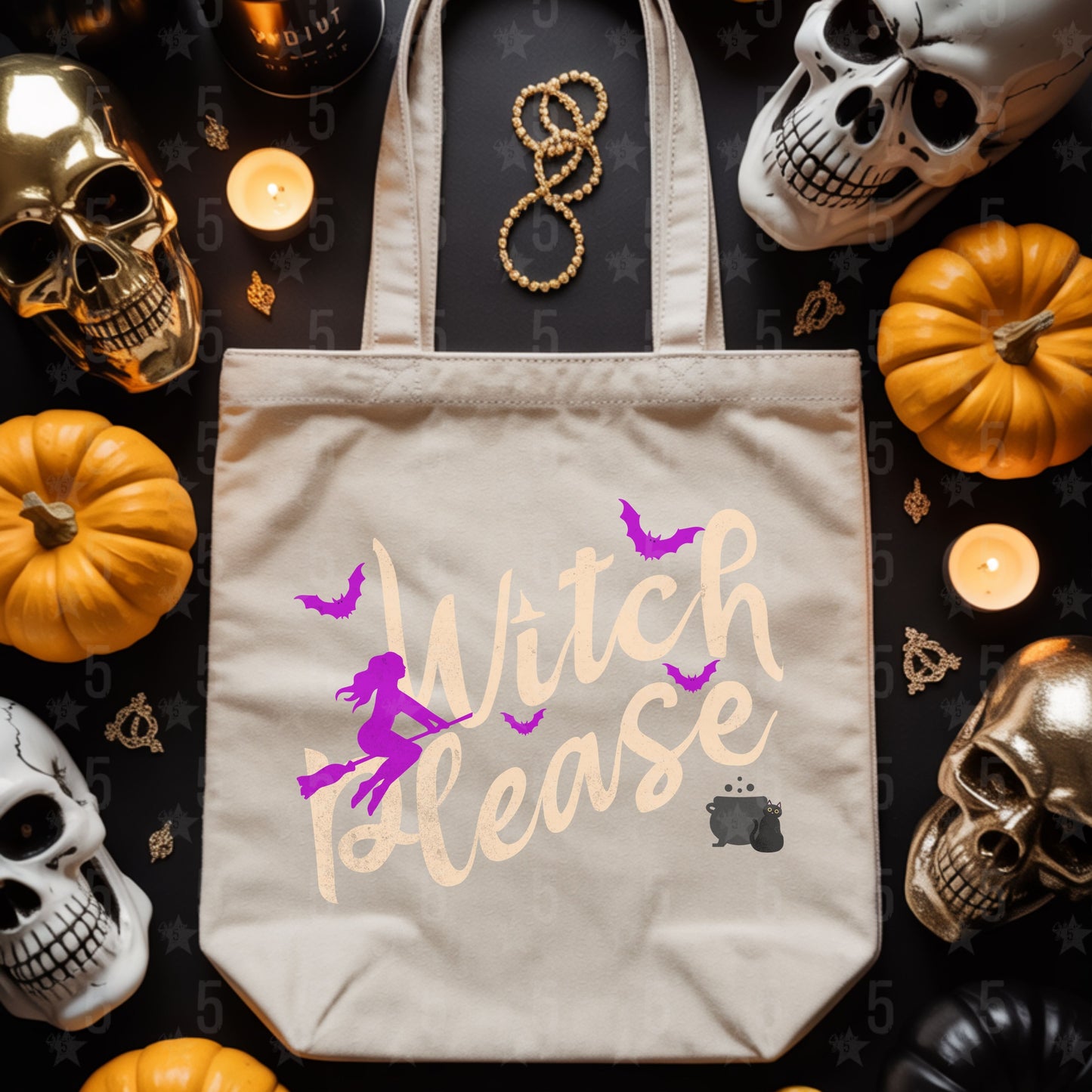 Beige tote bag with 'Witch Please' design surrounded by Halloween decorations on a dark surface.
