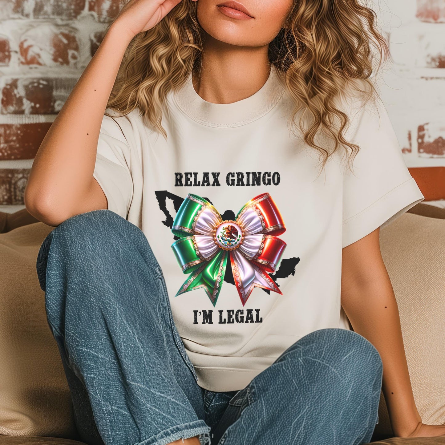 Person wearing a white t-shirt with a Mexico bow graphic and text 'Relax Gringo I'm Legal'