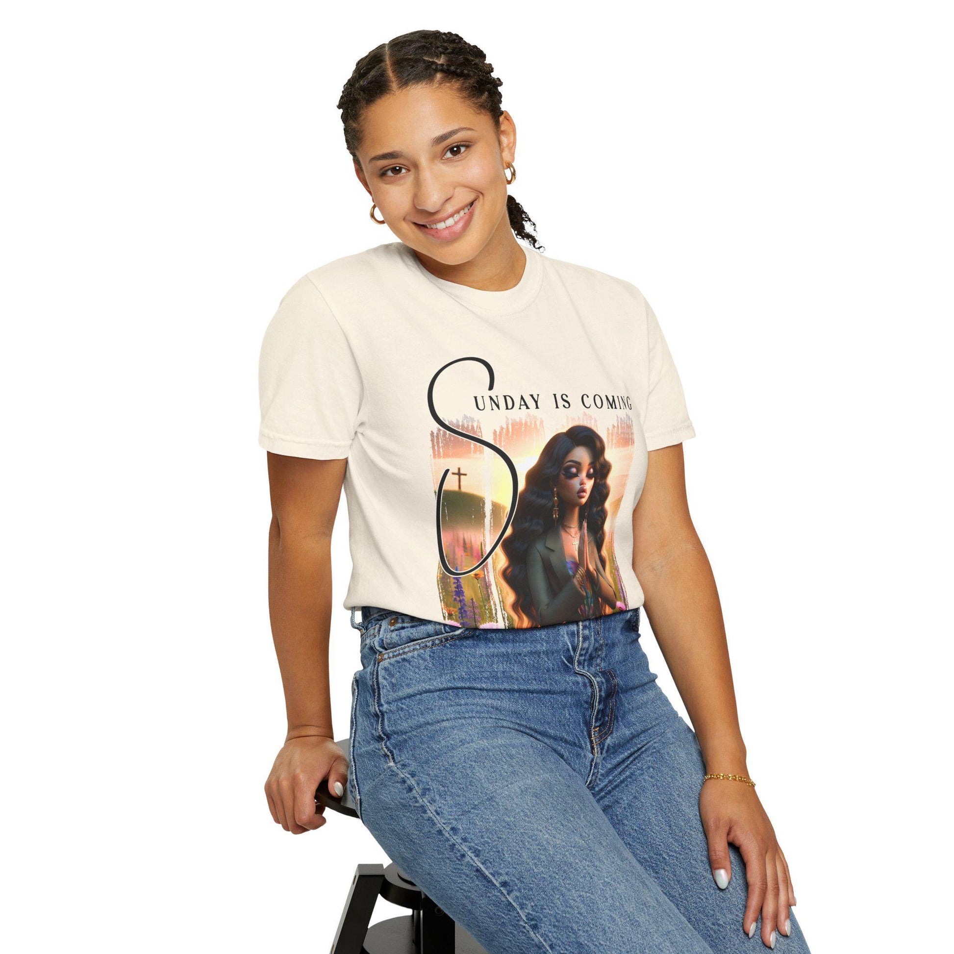 Person wearing a t-shirt with a sunday is coming design on a white background