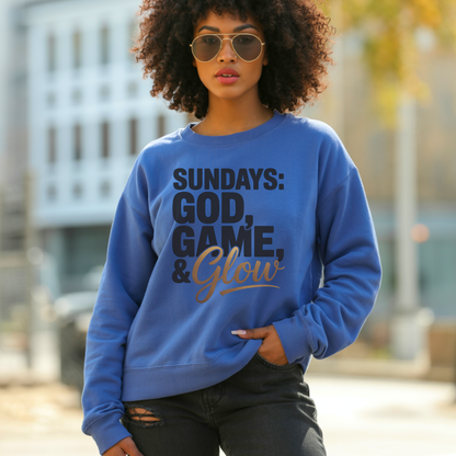Woman wearing a blue sweatshirt with sundays god game glow design standing outdoors