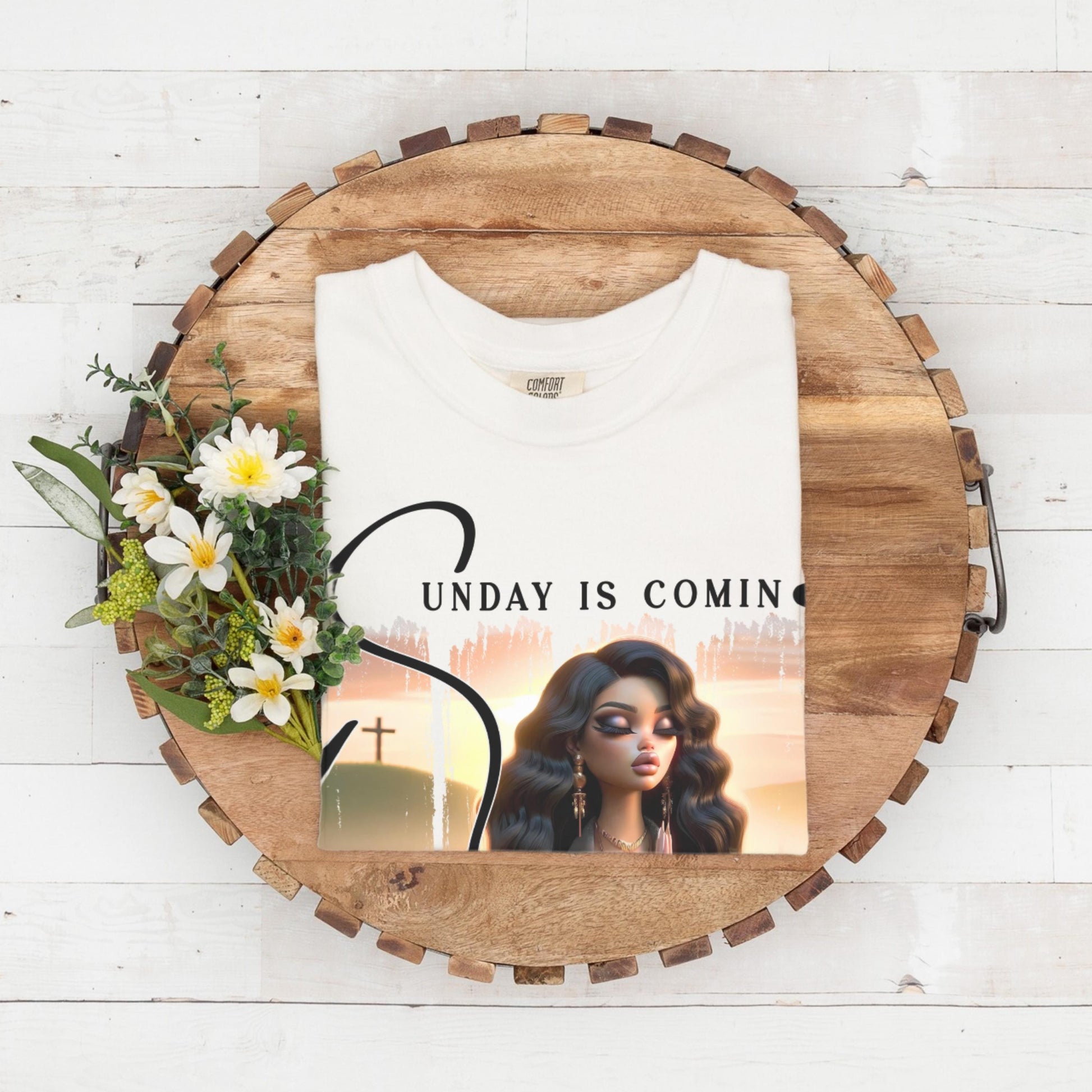 White folded top with sunday is coming design on a wooden circular tray with flowers