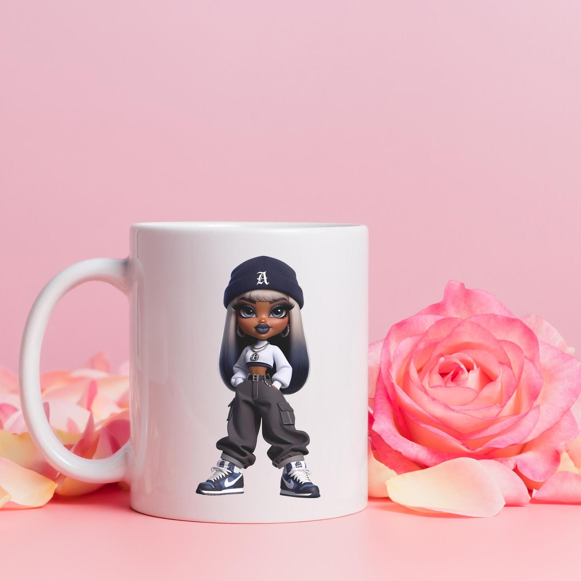 White mug with a bratz character wearing a cap, surrounded by pink roses on a pink background
