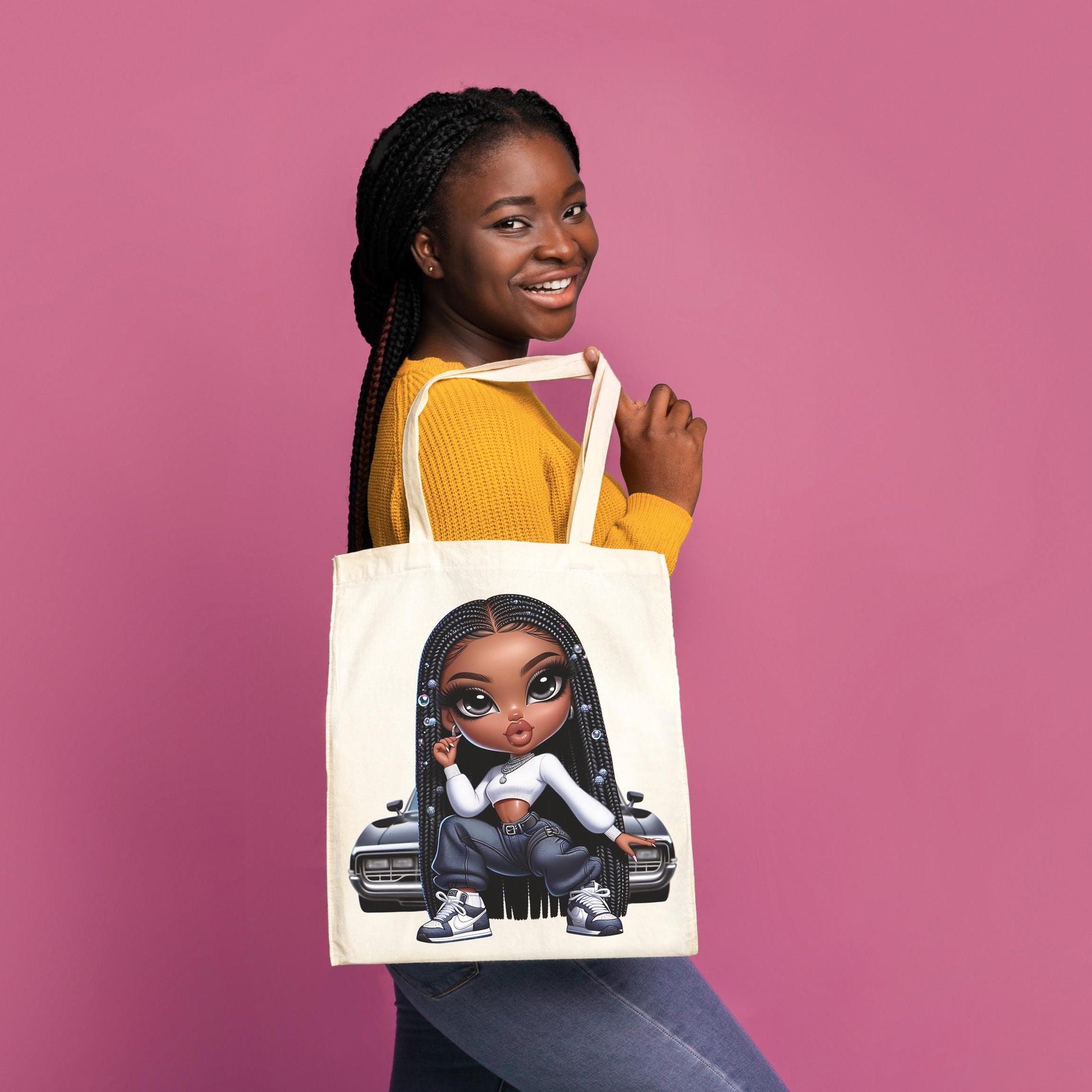 Woman holding a tote bag with a gnx bratz character on a pink background